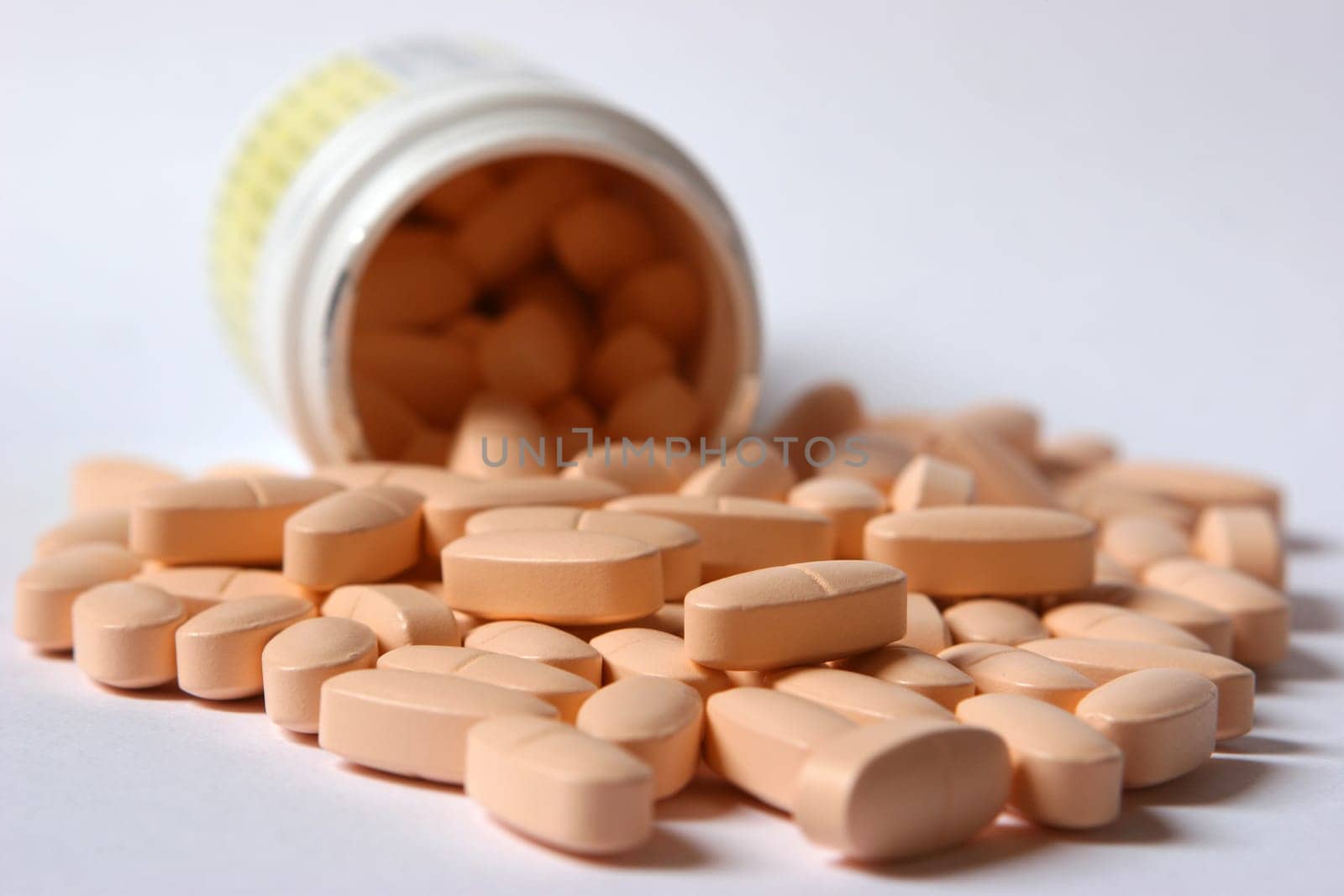 Cans and tablets on white background / aperture 9