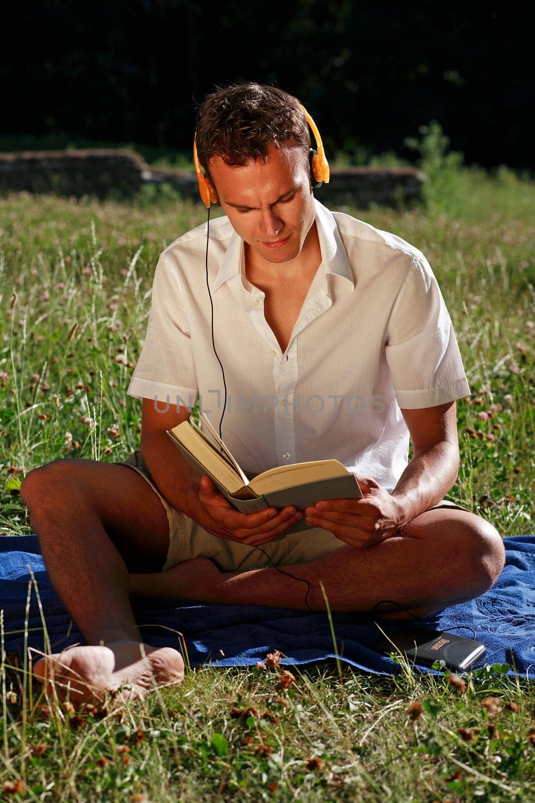 Student with book and headphones I