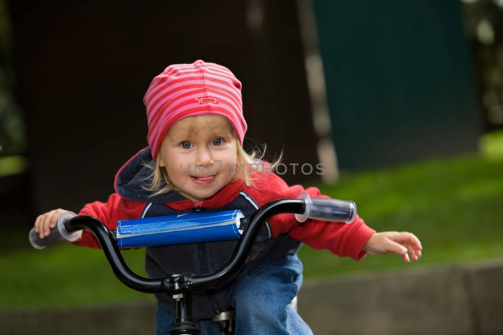 A little girl on a bicycle