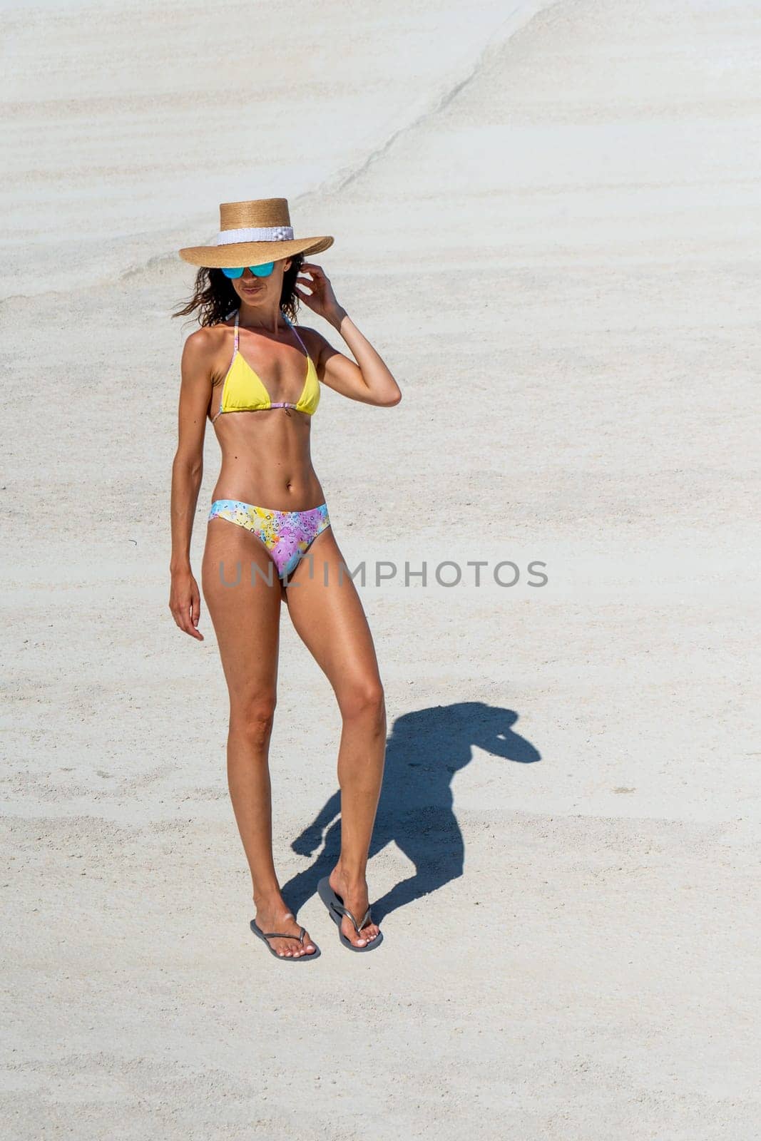 Model in bikini on Sarakiniko beach, Milos Island