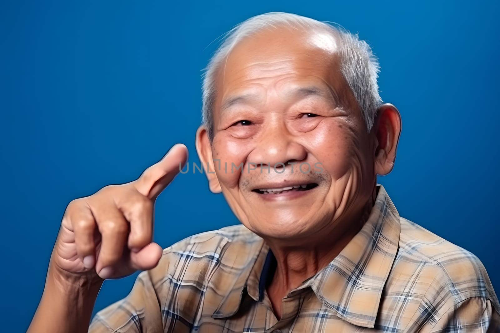 Asian grandfather looking and smiling with rised index finger on blue background. Neural network generated in May 2023. Not based on any actual person, scene or pattern.
