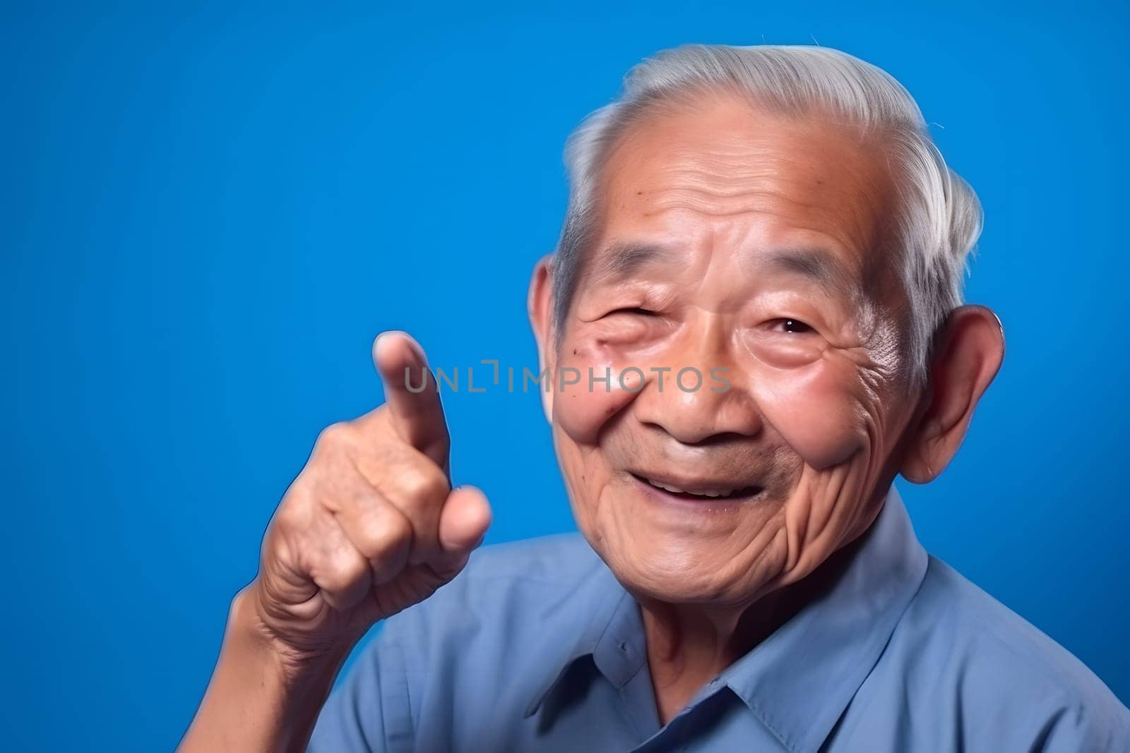 Asian grandfather looking and smiling with rised index finger on blue background. Neural network generated in May 2023. Not based on any actual person, scene or pattern.