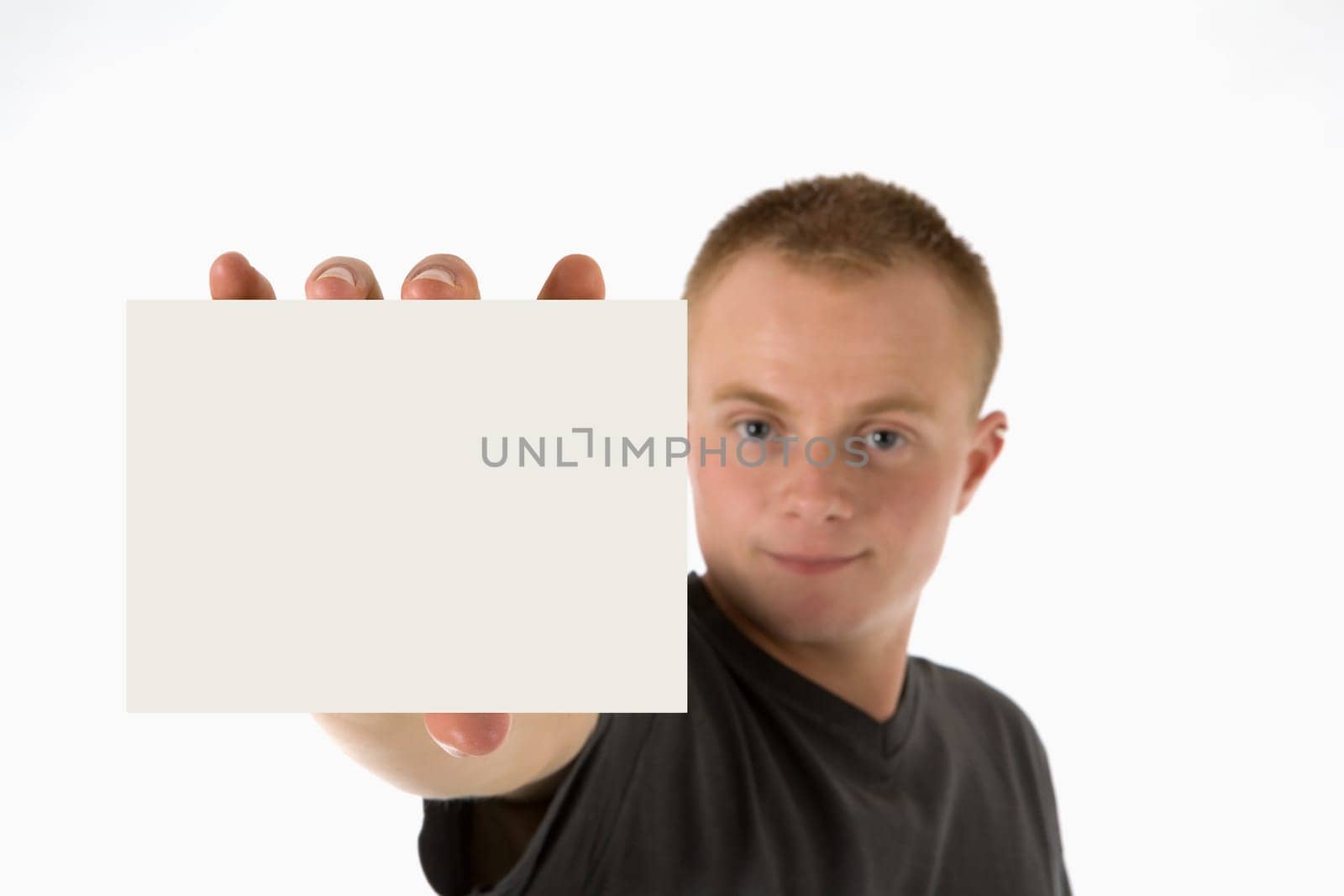 A young man holds an empty pad