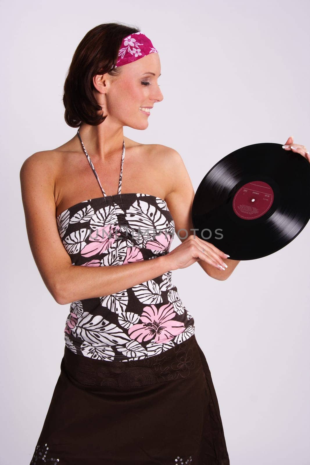 A woman presents a vinyl record