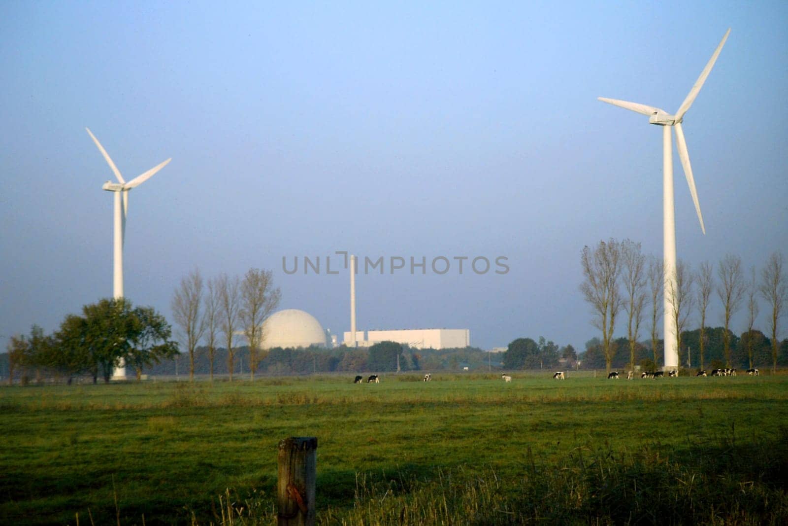 Wind turbines in front of Unterweser nuclear power plant
