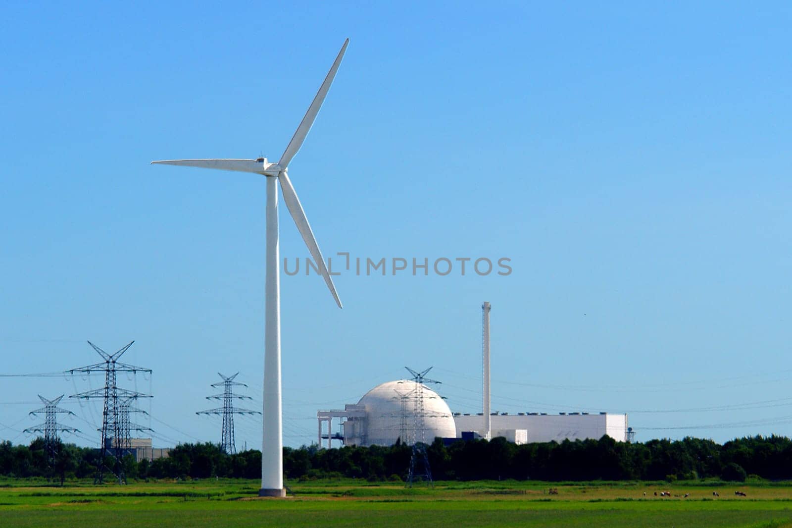 Wind turbine in front of Unterweser nuclear power plant