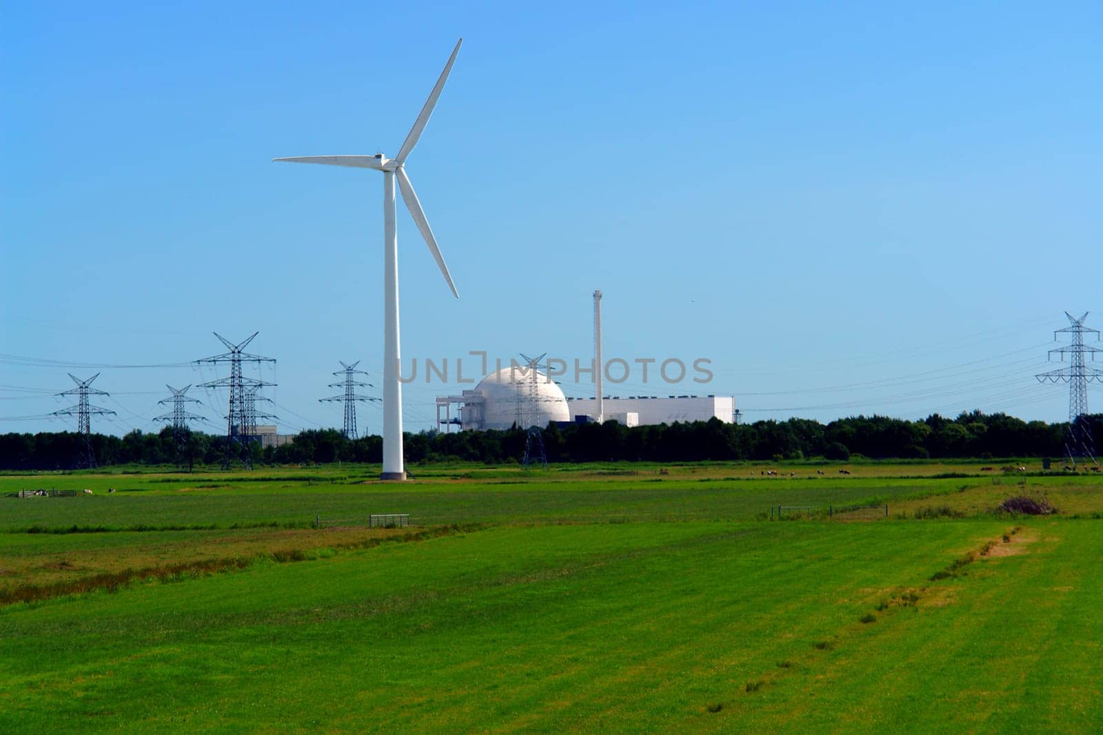 Wind turbine in front of Unterweser nuclear power plant