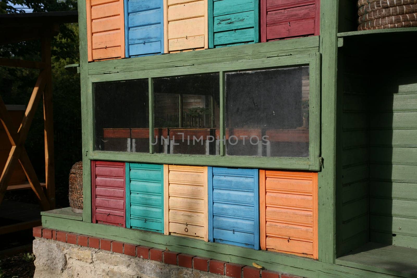 Colored fronts of beehives of a beekeeper
