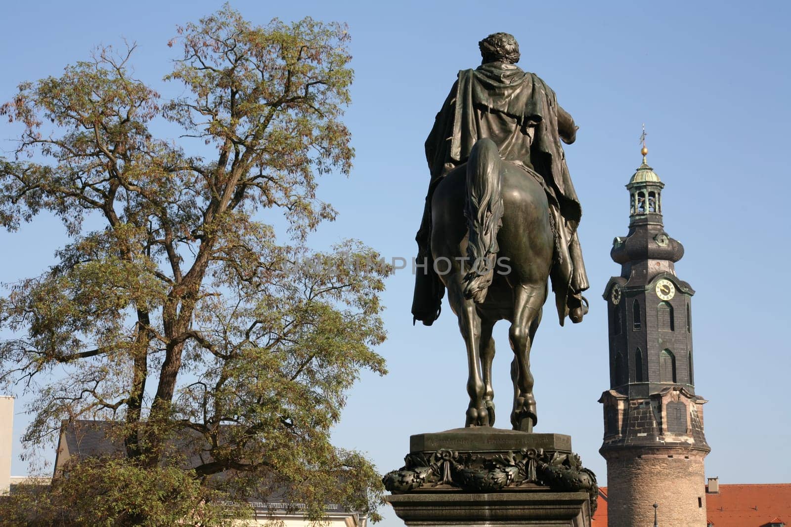 Equestrian statue on the Platz der Republik in Weimar,in the background the tower of the Residenzschloss