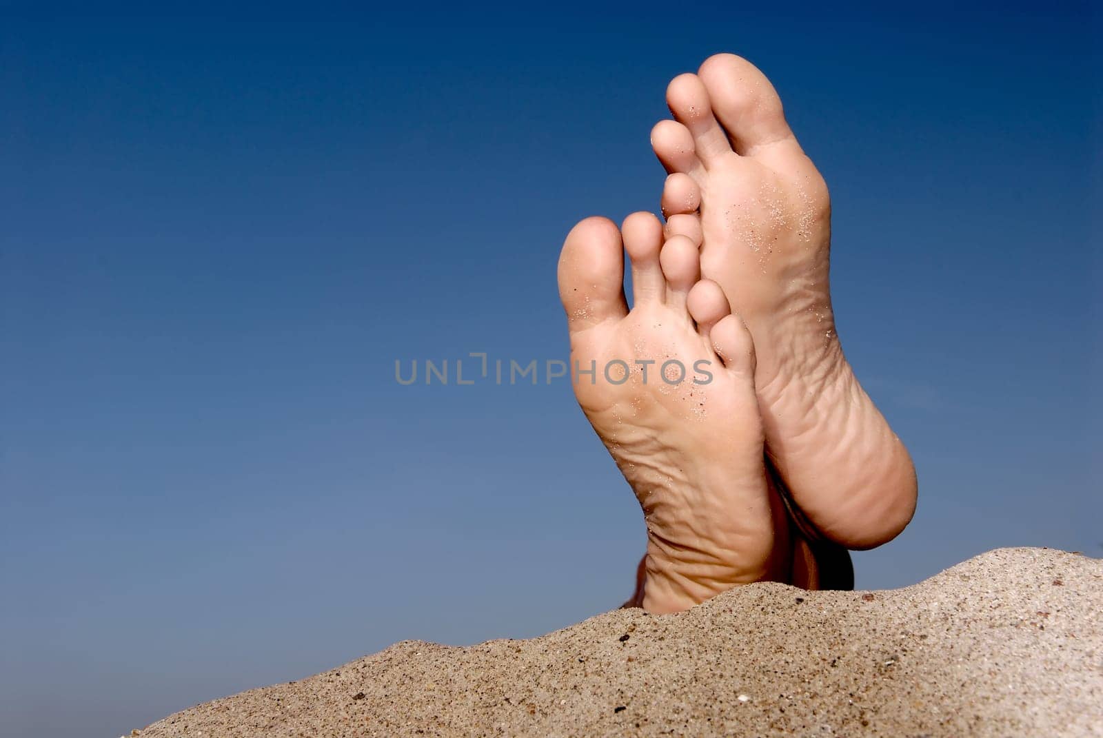 Feet on the beach.