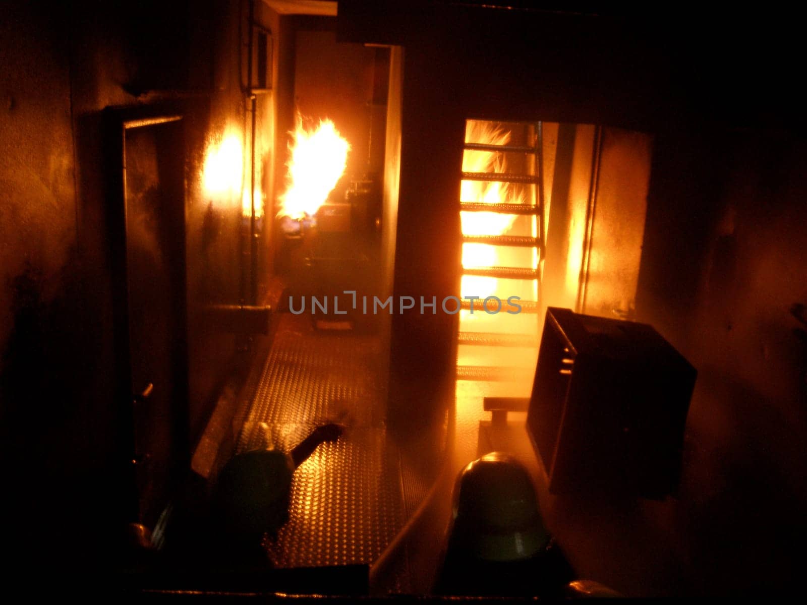 This picture was taken in a fire brigade training room. Since I had to take pictures through a shield,unfortunately no flash was possible. But you can see what the men have to do! Attention!!