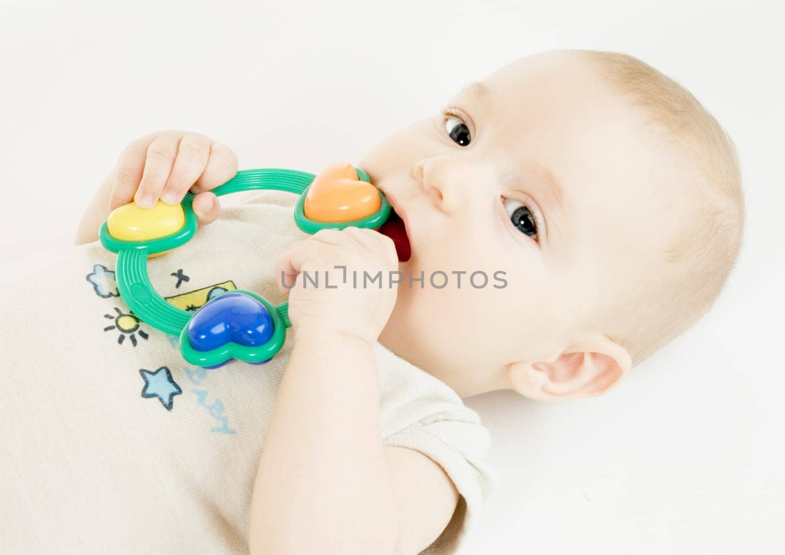 Baby with rattle (about 4 months old)