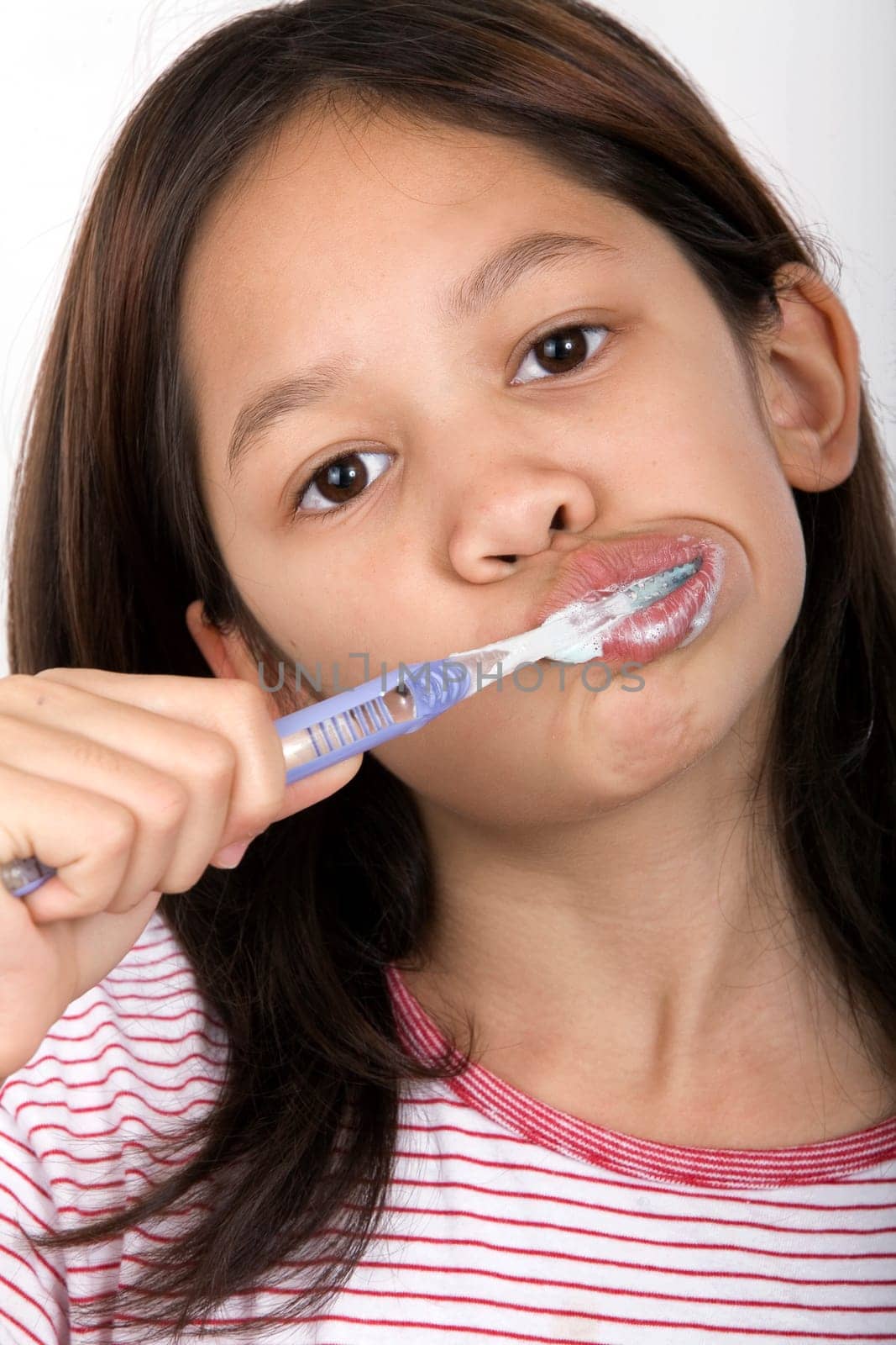 Girl brushing her teeth