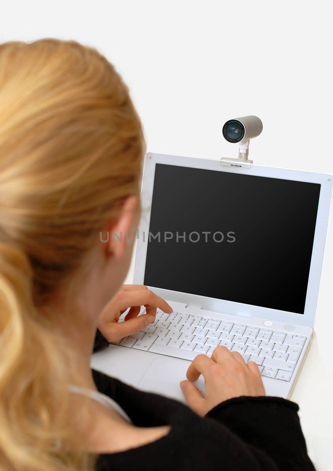 Woman with laptop and webcam