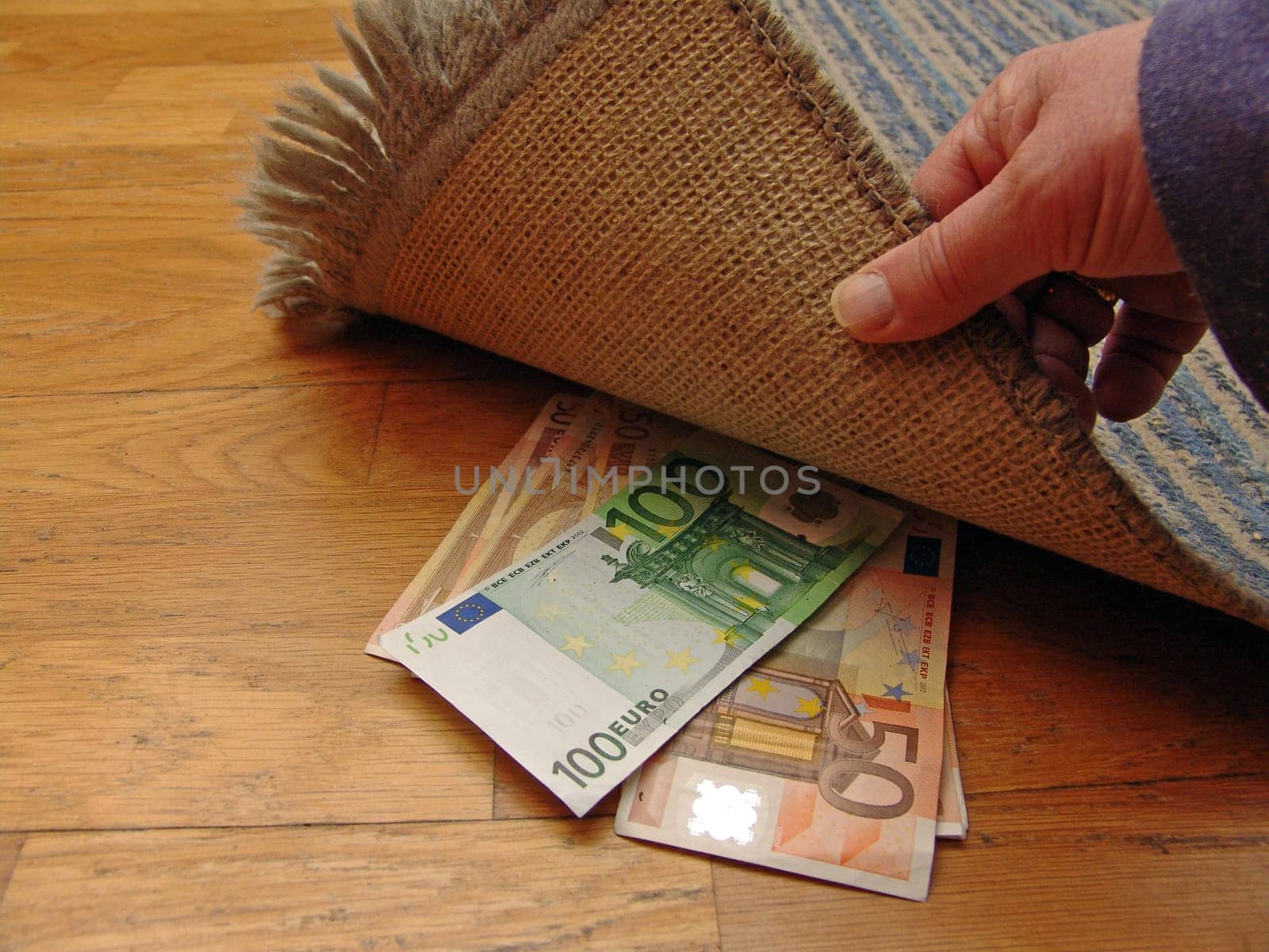 Money under carpet