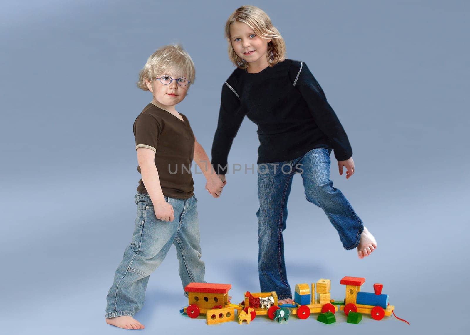 Siblings hand in hand