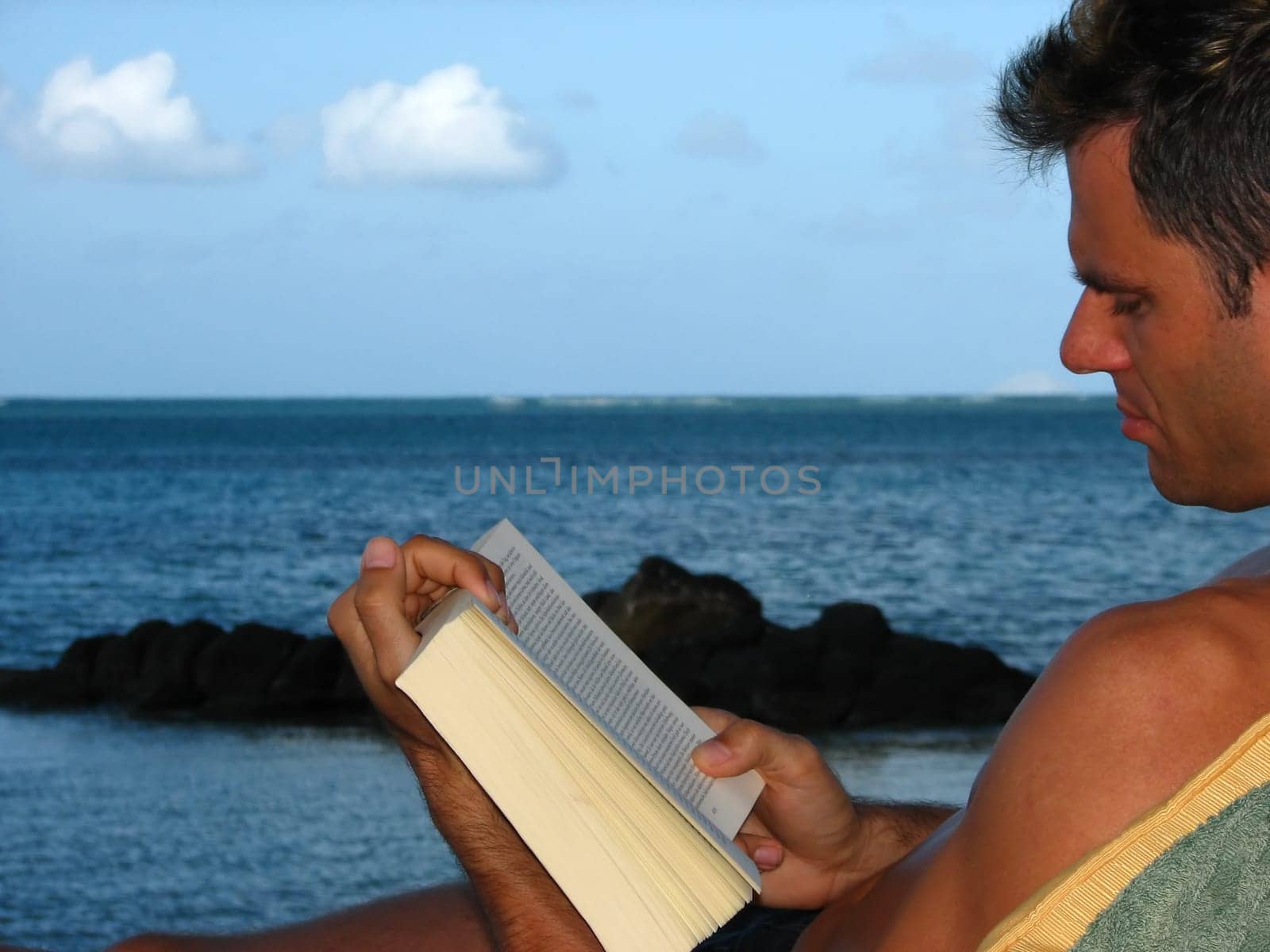 Reading by the sea,here even the boys will find time and peace to read. A rare sight for me,I only know them in front of the PC.