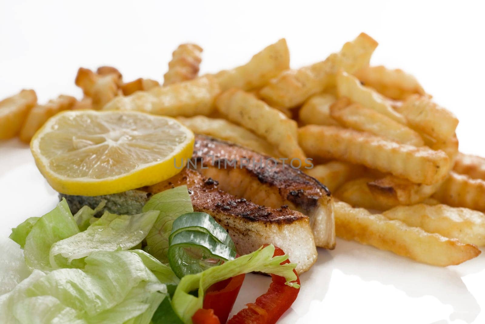 fried salmon with French fries and salad