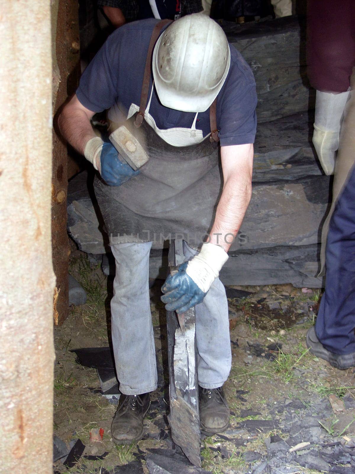Worker splits slate