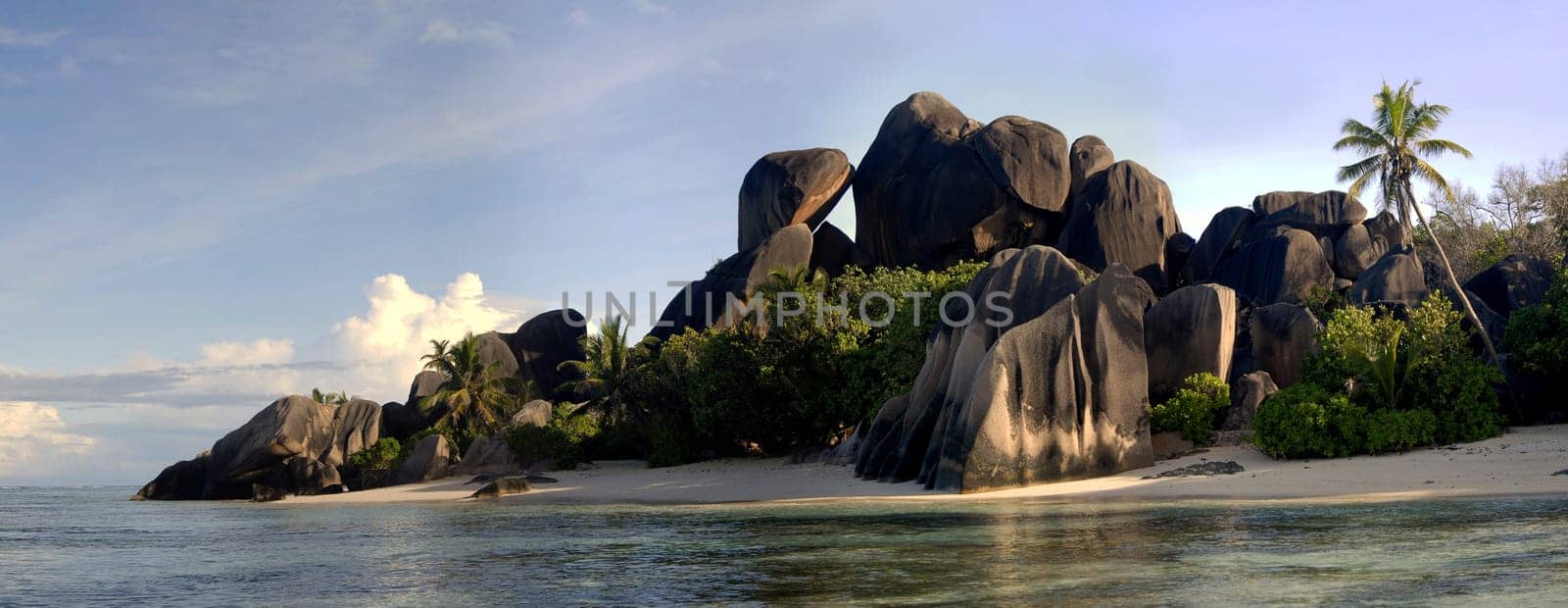 Anse Source d'Argent is located on the island of La Digue in the Seychelles. The image is composed of five portrait images.