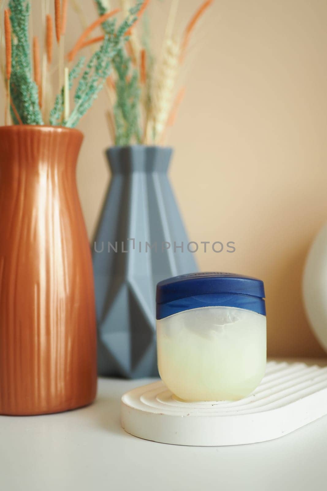 Close up of petroleum jelly in a container .