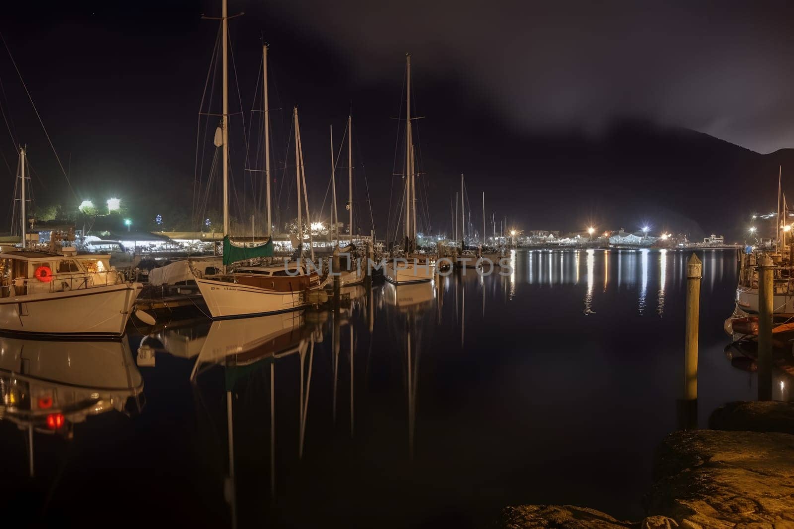 Boats in the harbor at night. Neural network generated in May 2023. Not based on any actual person, scene or pattern.