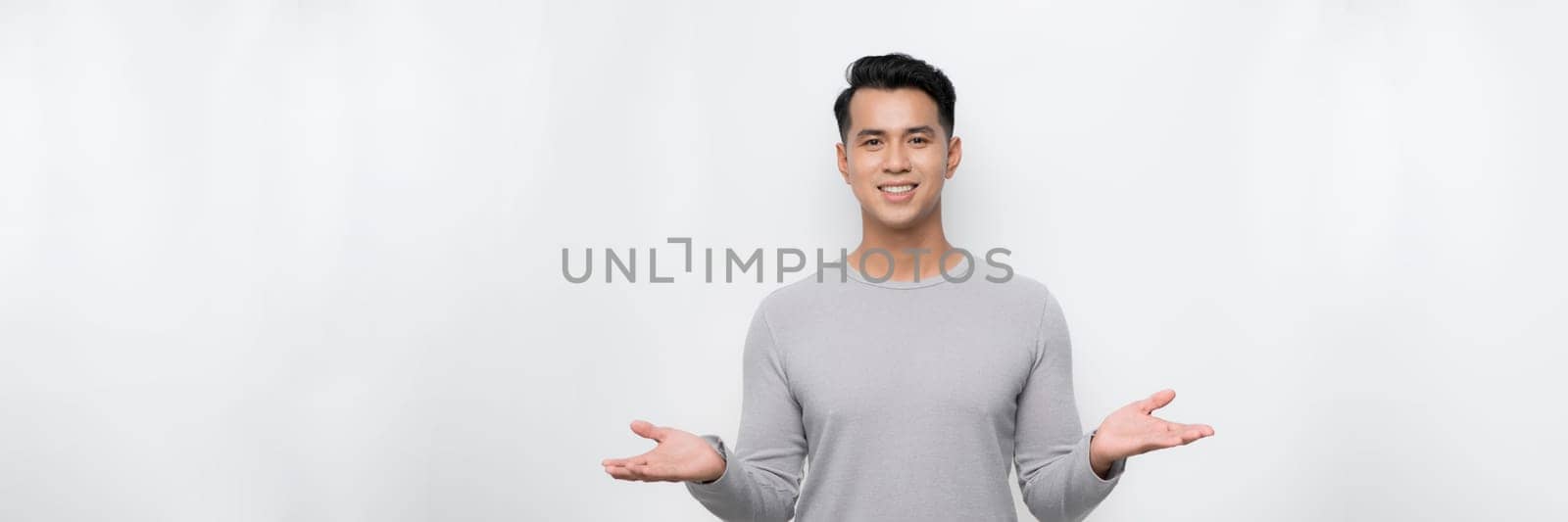  asian young man with both hands presenting something