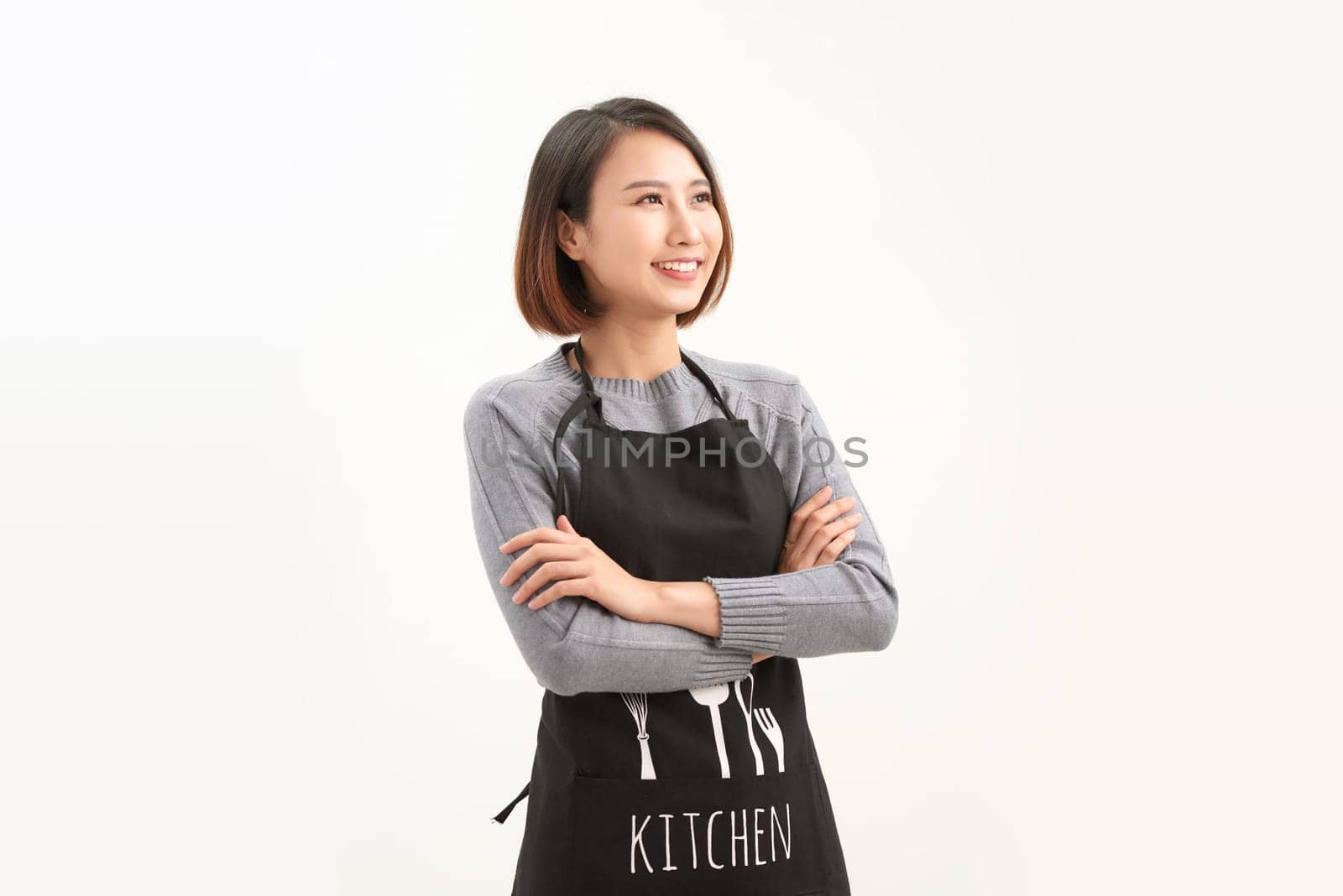 portrait of Asian woman wearing apron on white background by makidotvn