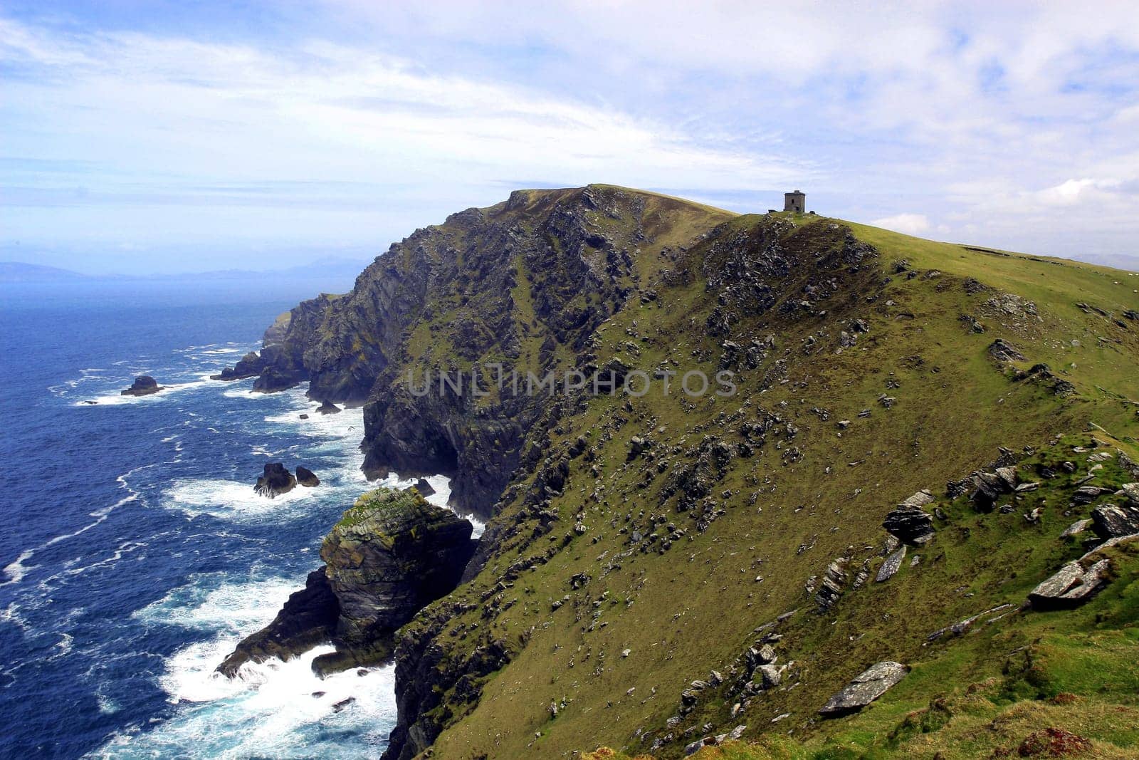 At Bray Head on the western tip of the Iveragh Peninsula,Ireland. The lighthouse house is only exposed to wind and weather and decays.