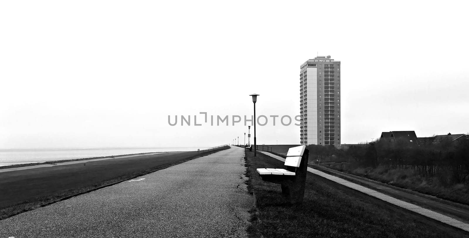 Who would come up with such a thing? A high-rise building directly behind the dike.
