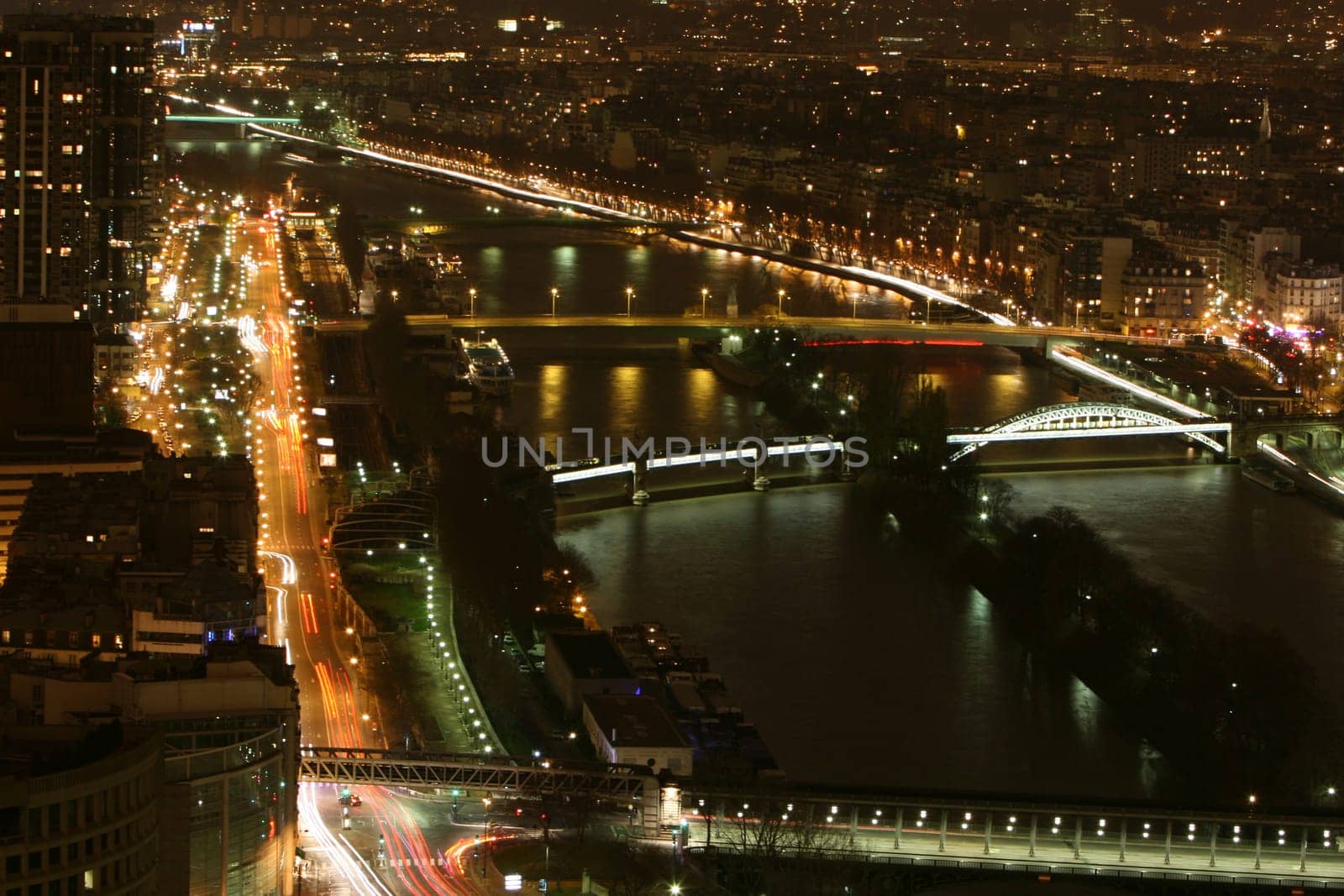 View from the Eiffel Tower to the Port de Grenelle,next to it the river Seine which flows from east to west and flows into the English Channel. With a length of 776 km,it is the third longest river in France.