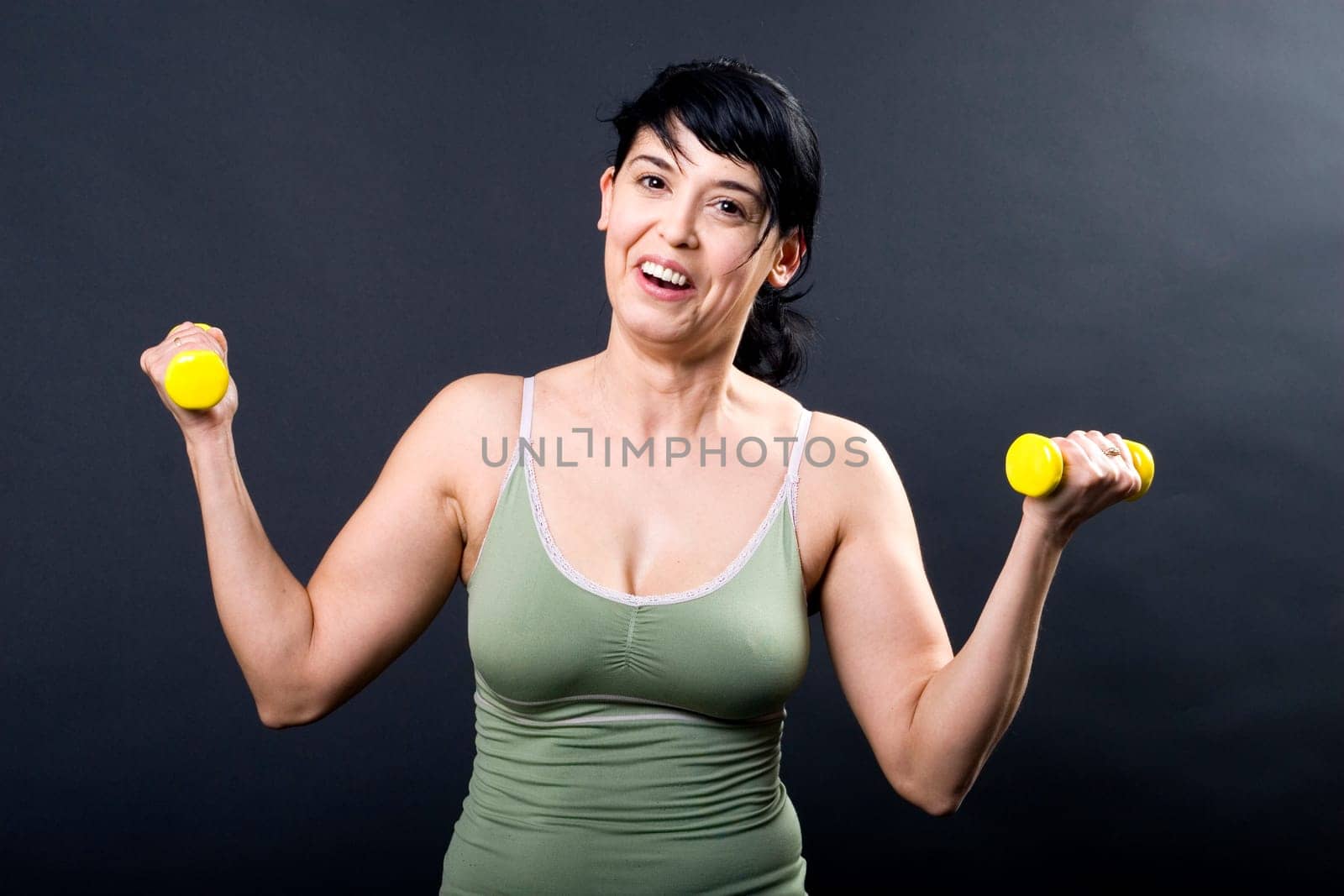 Olivera with dumbbells cheerful