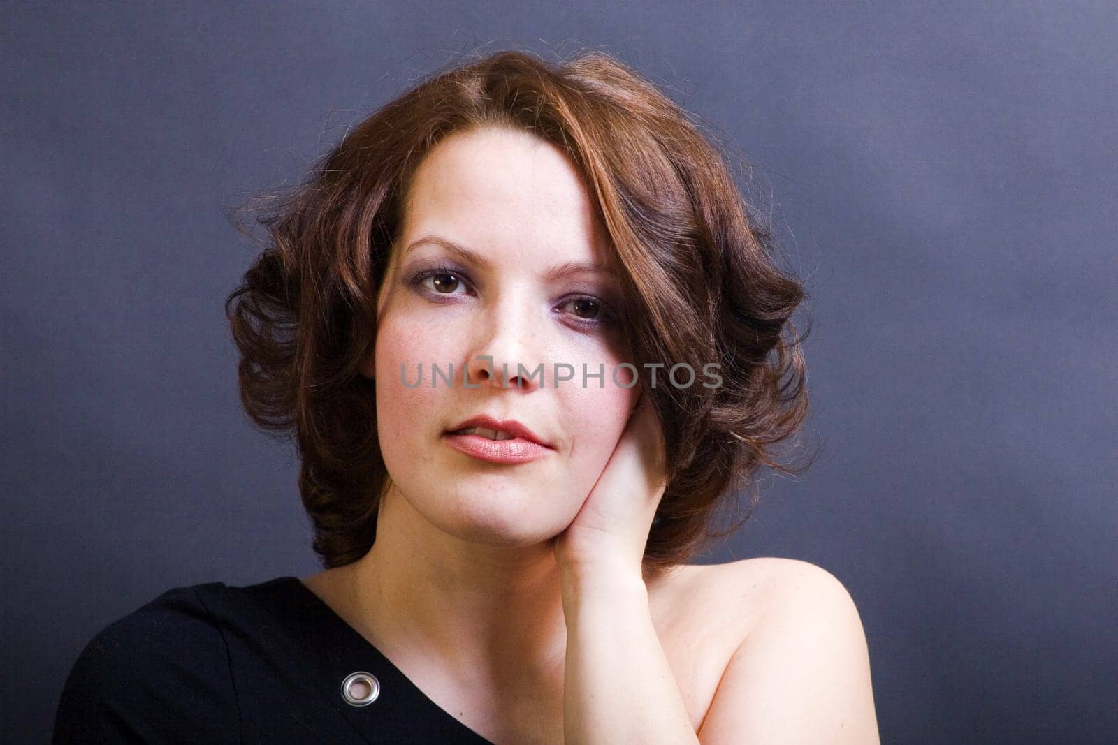 Angelique's hand on her ear