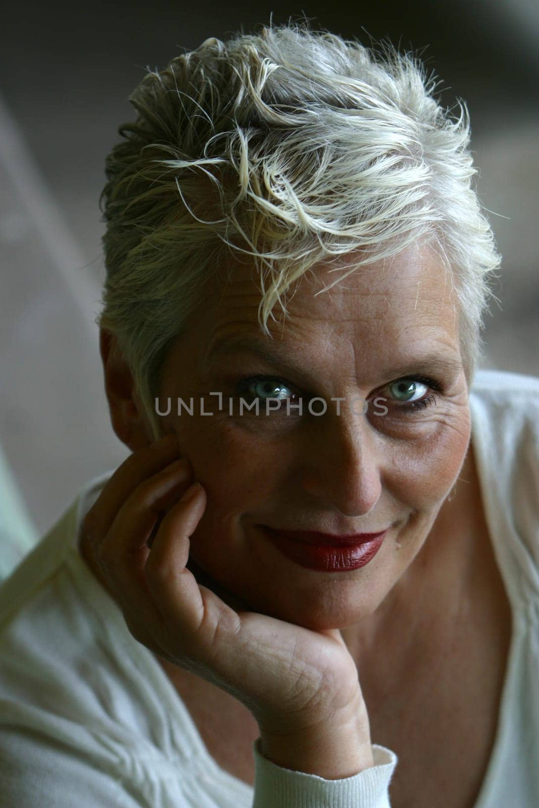 white-haired woman in her 50s