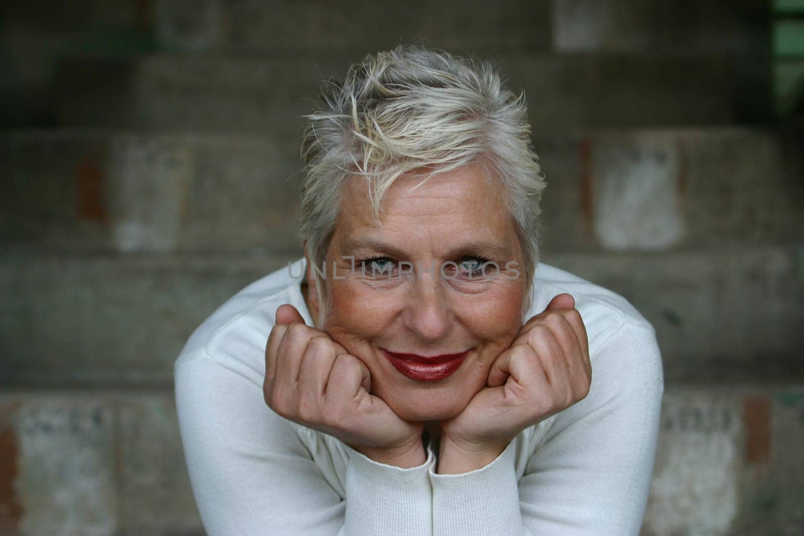 white-haired woman in her 50s