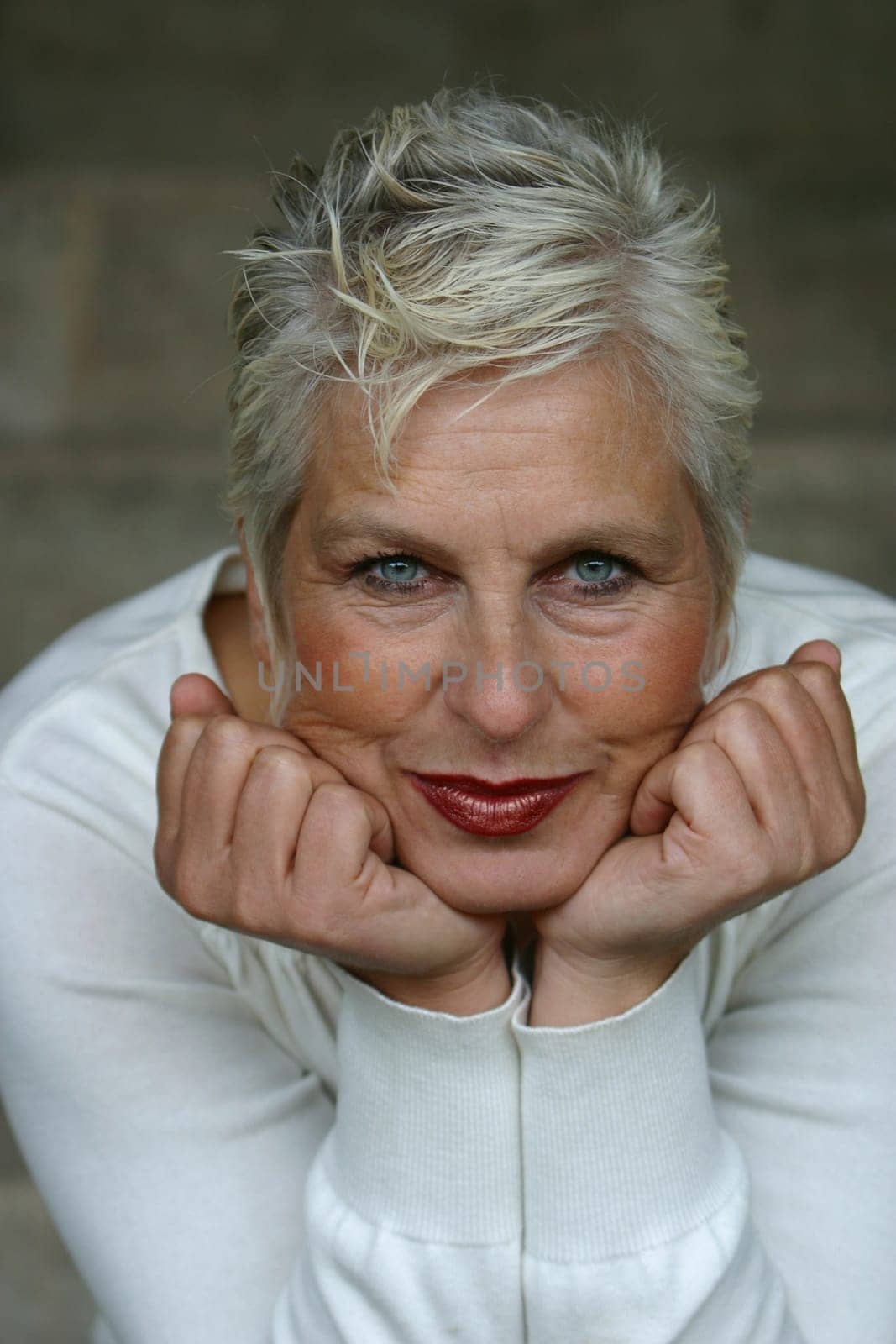 white-haired woman in her 50s