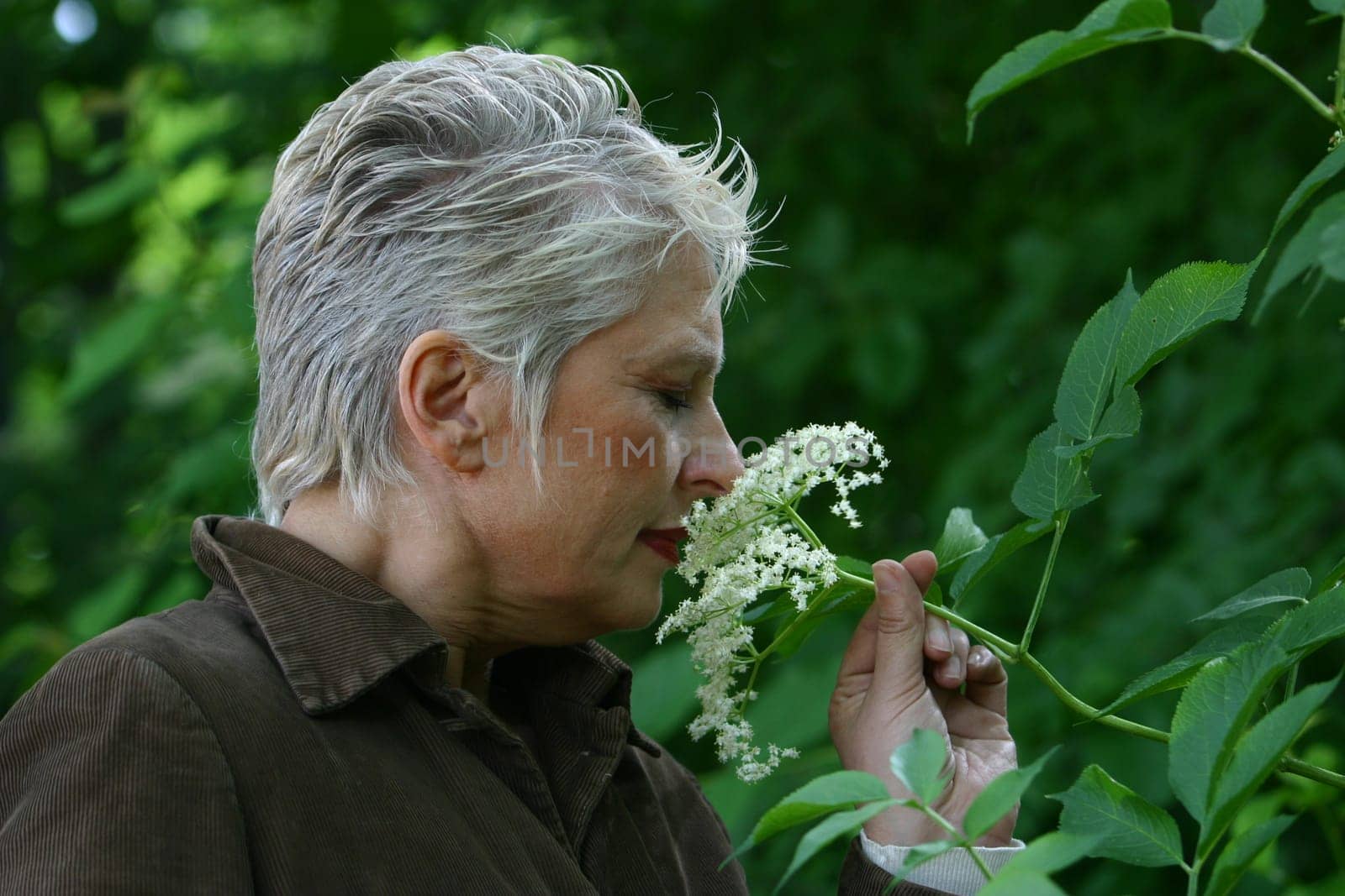 white-haired woman in her 50s