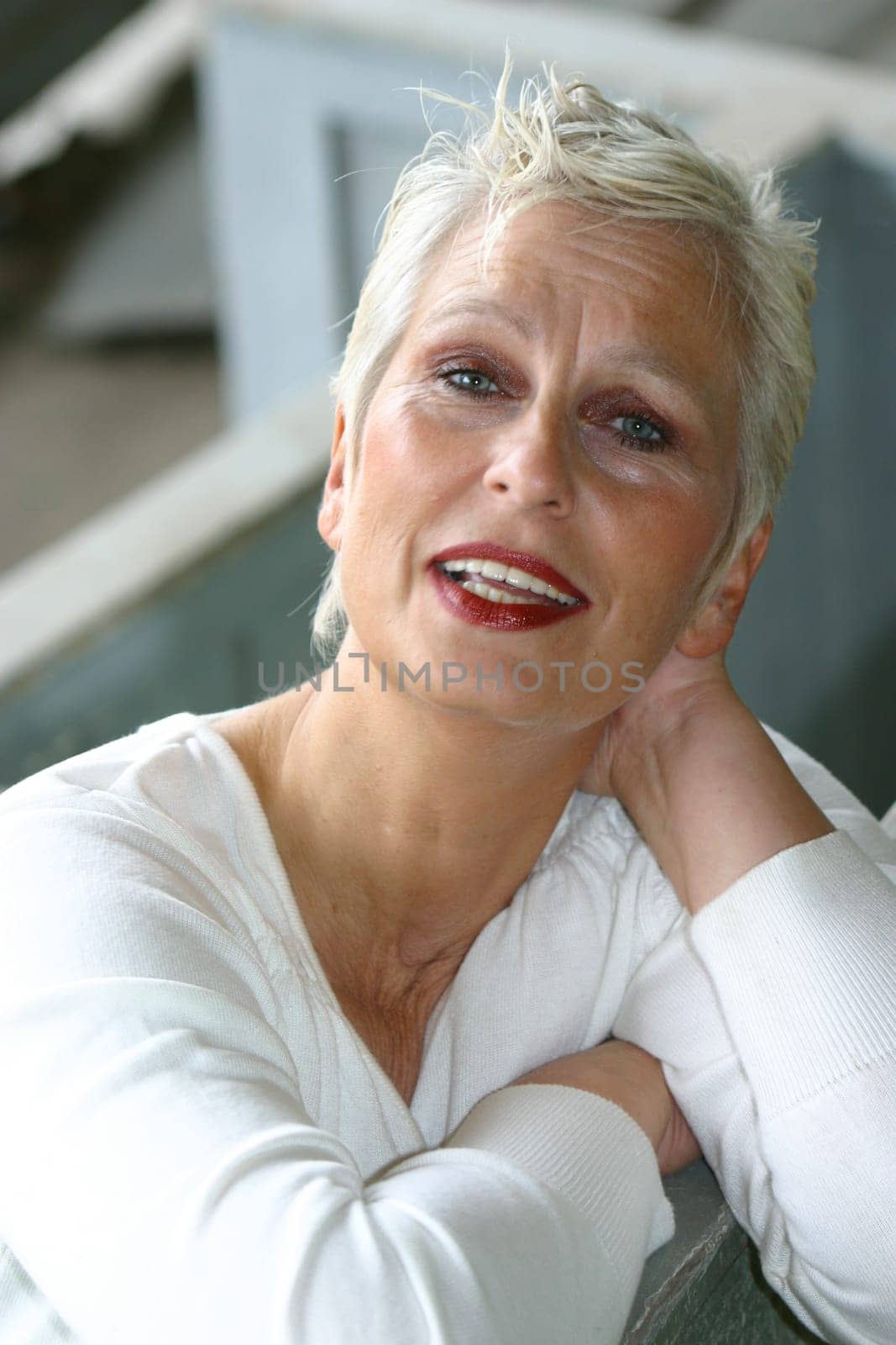 white-haired woman in her 50s