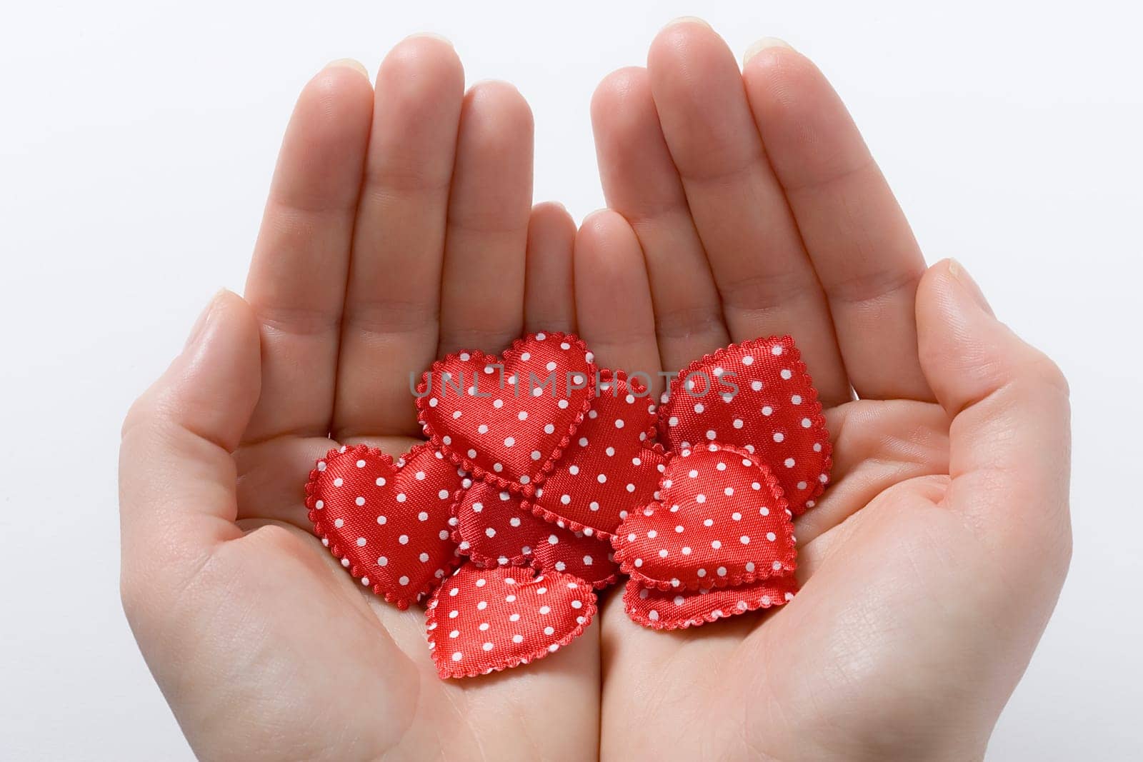 Hands with cloth hearts