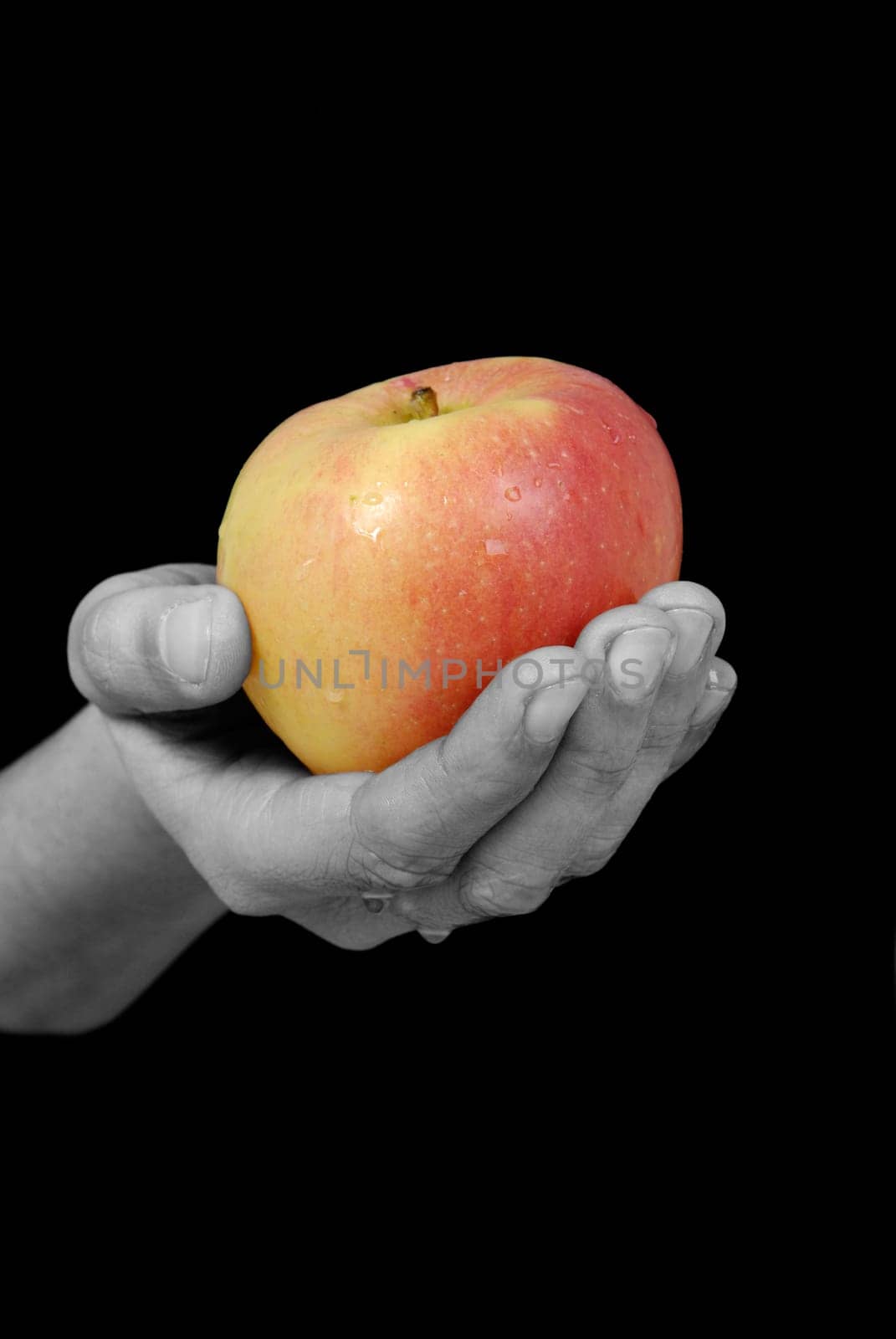 Hand with apple