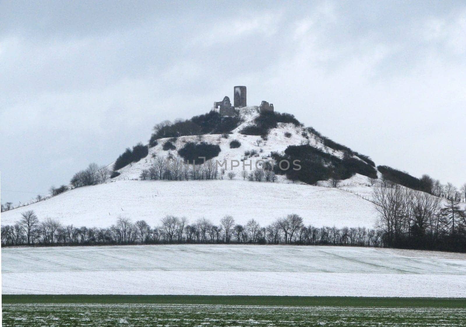 The Desenberg is the most prominent elevation of the Warburg Börde,a fertile and relatively flat basin in East Westphalia in the district of Höxter. It is a basalt dome crowned by a castle ruin and a testimony to the recent history of the earth,volcanism