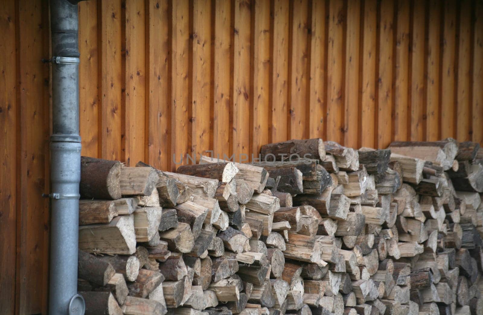 Stacked logs on a house wall