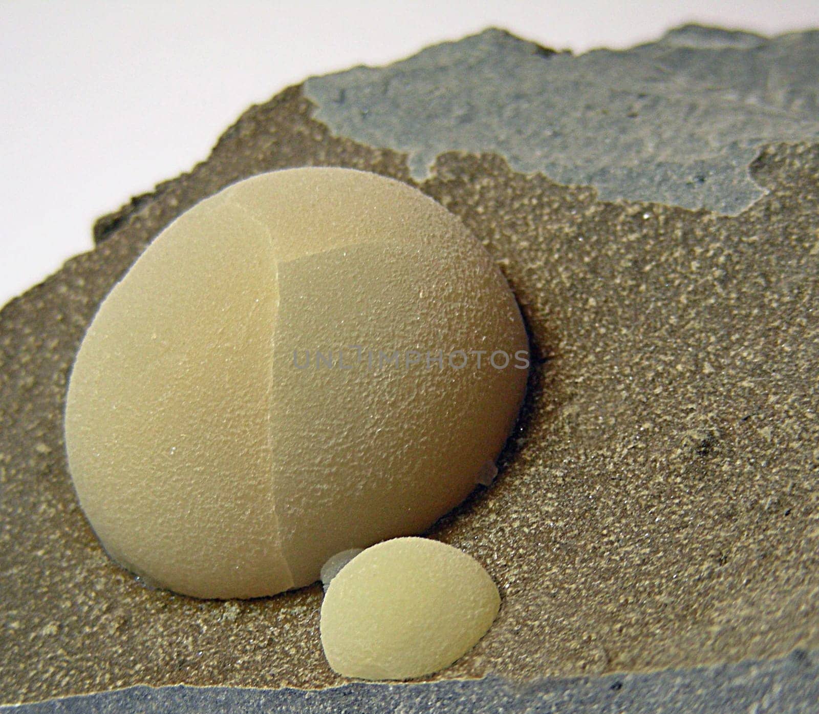 Calcite in spherical form on basalt / Location: Montalto di Castro,Tuscany ----- The name calcite is derived from the Greek "chal"" or from the Latin ""calx"": both mean lime. Calcite has the highest kris of all minerals"