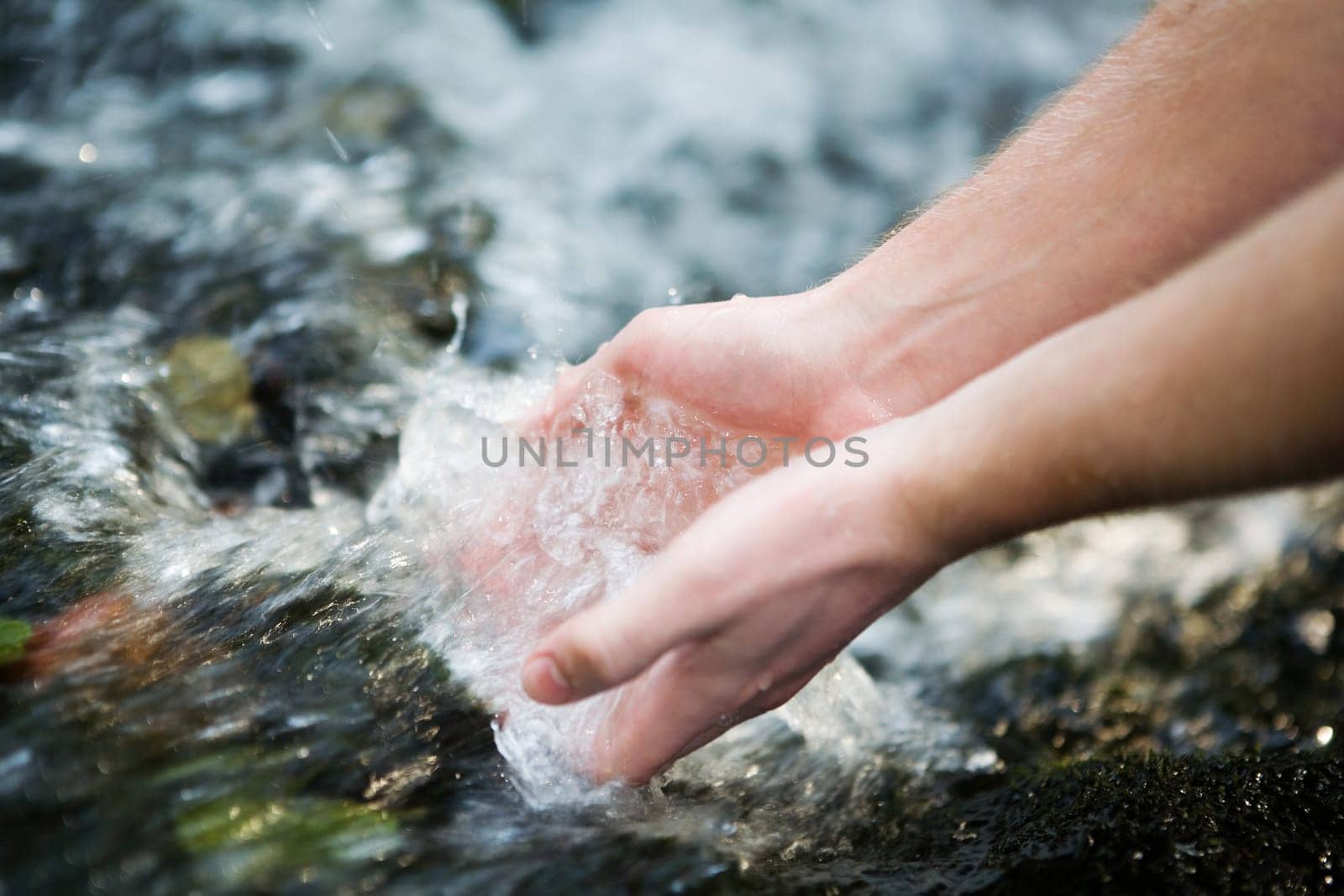 Hands in the water