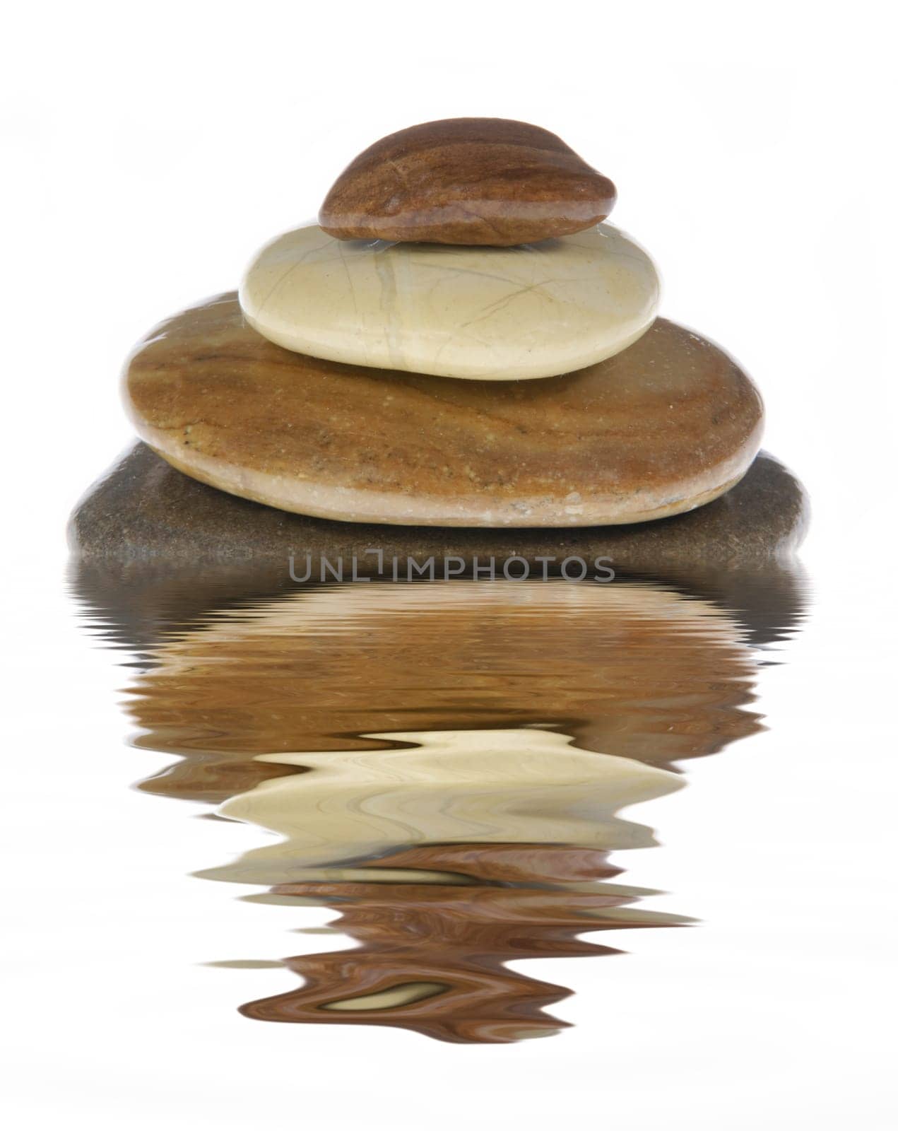 Stack of stones reflected in the water