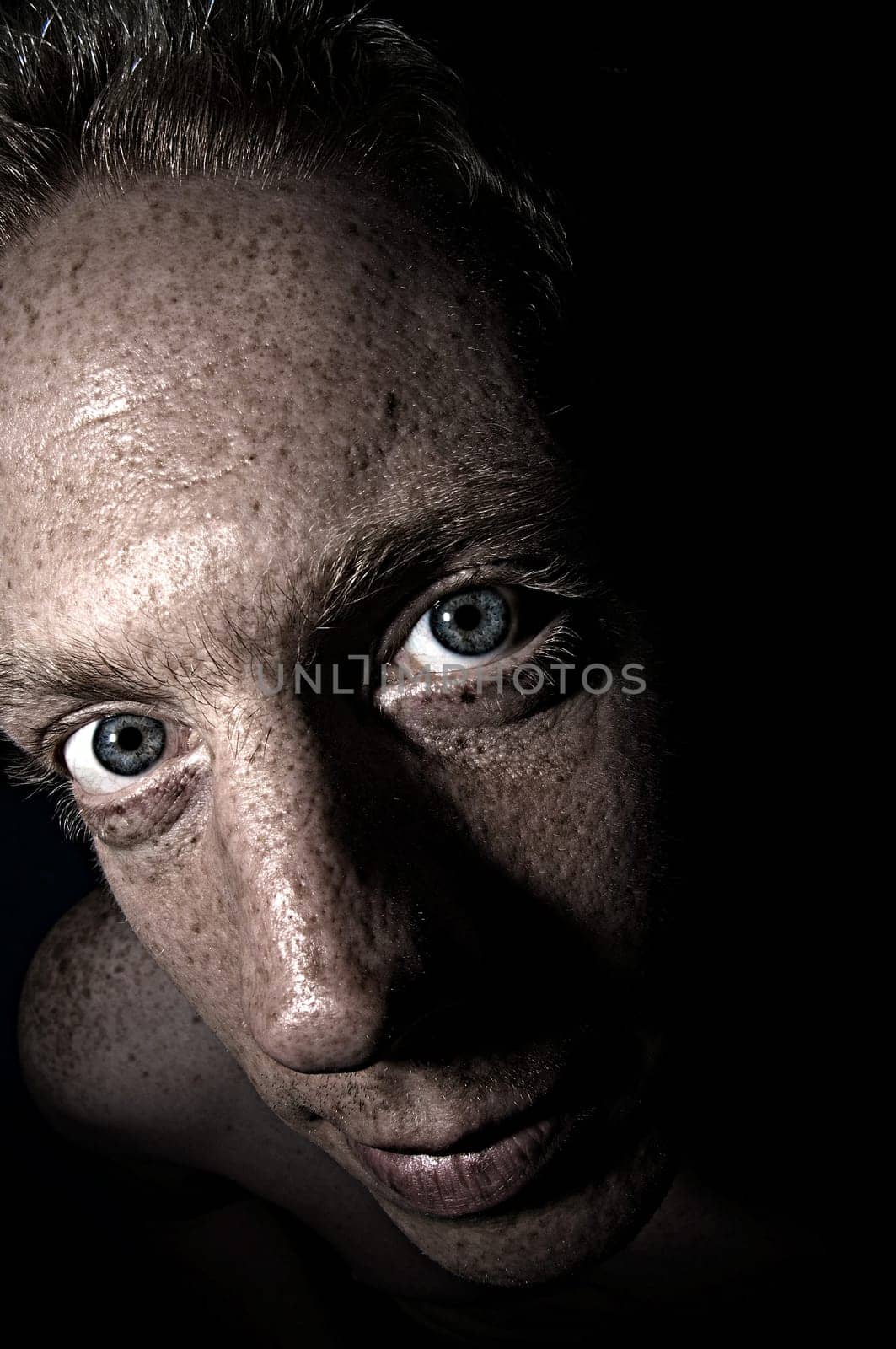T.
