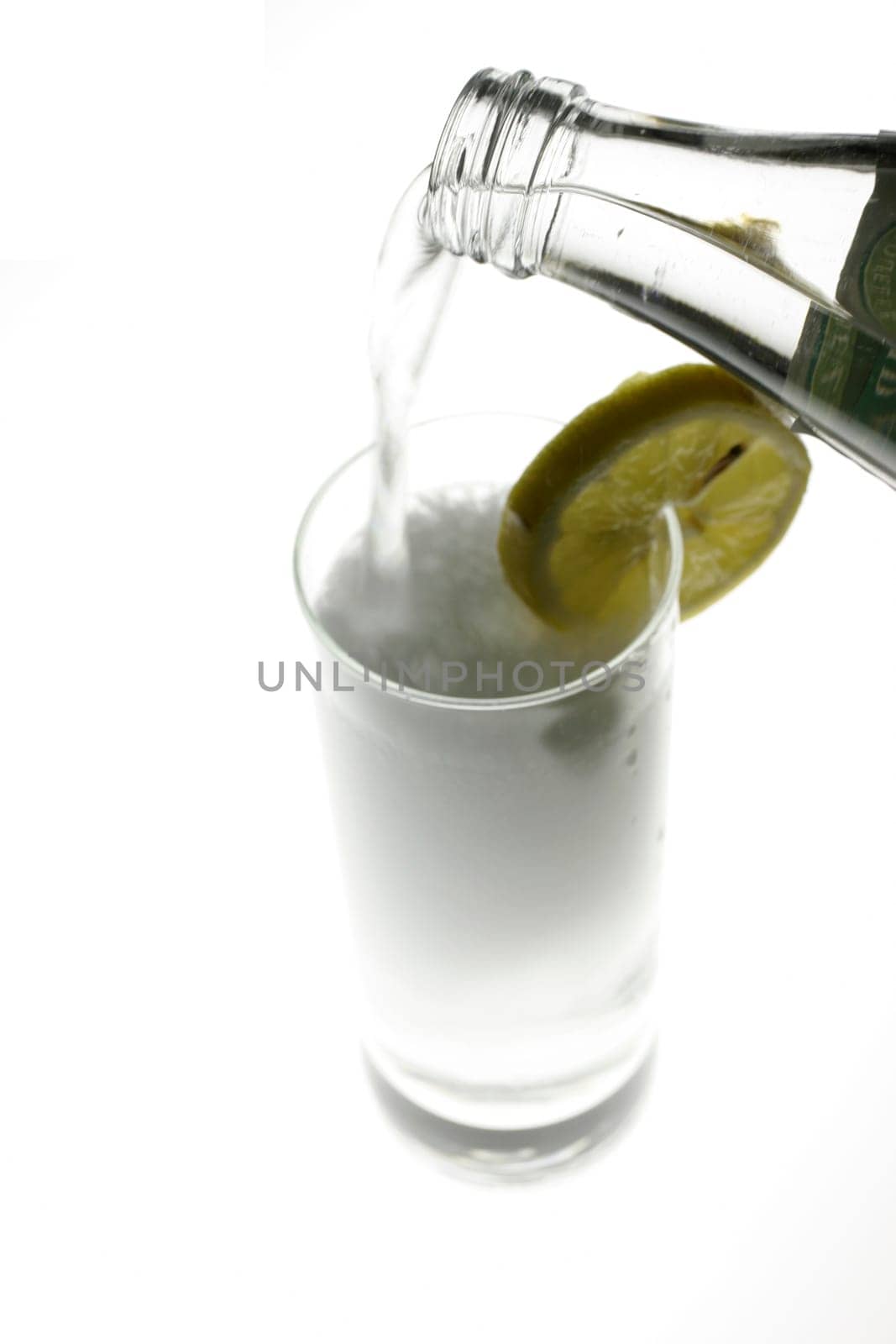 Glass of water is poured