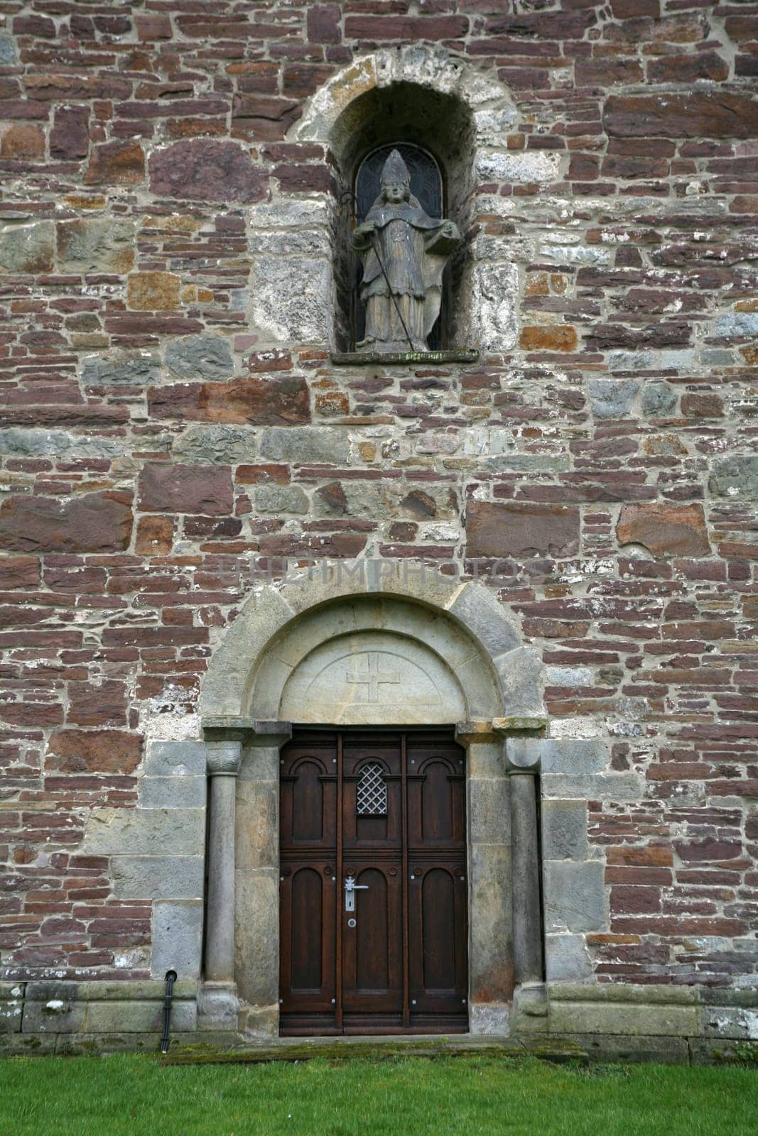 The statue of the namesake of the Romanesque St. Kilian's Church in Lügde (Lippe district,North Rhine-Westphalia)