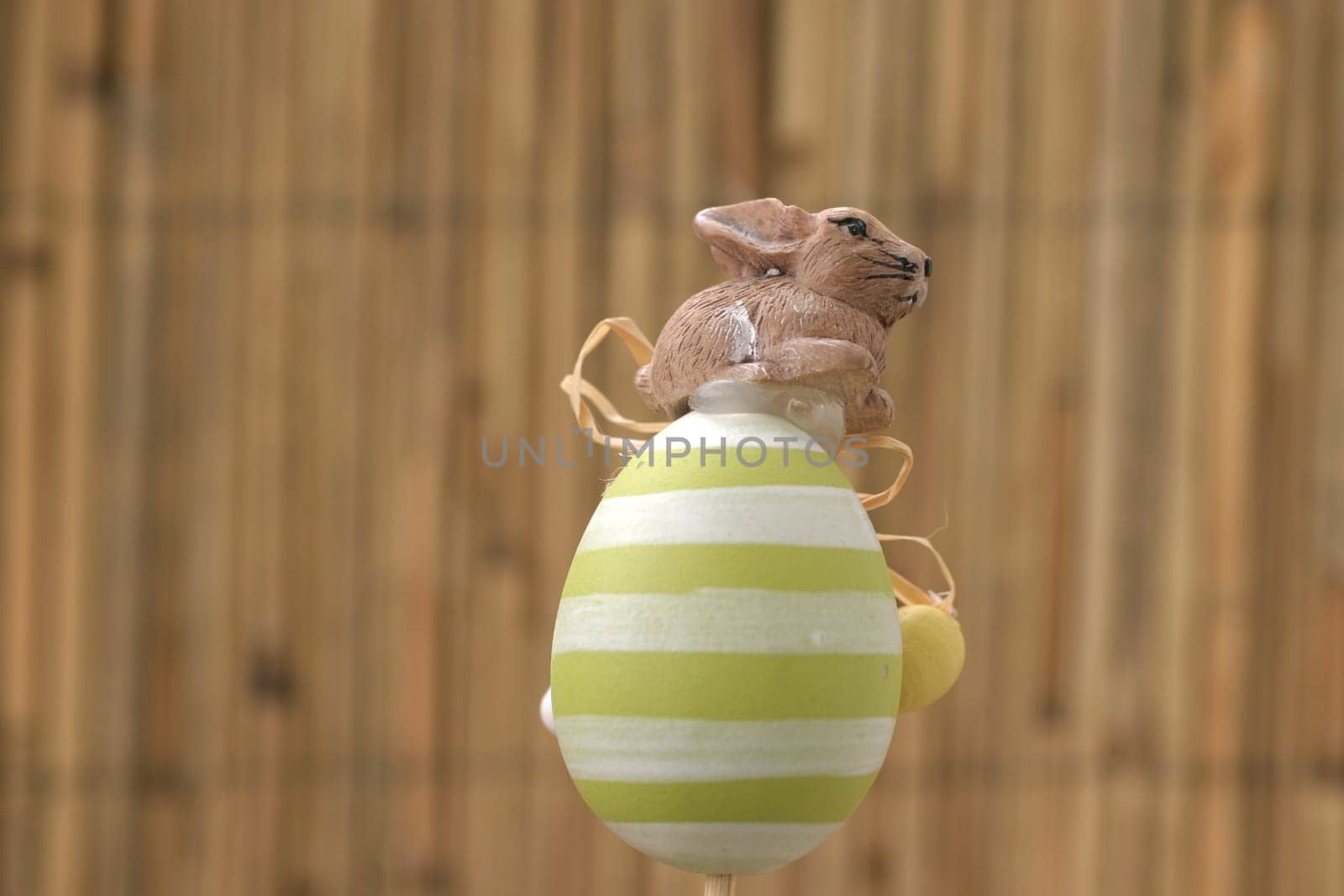Ceramic rabbit on ceramic egg