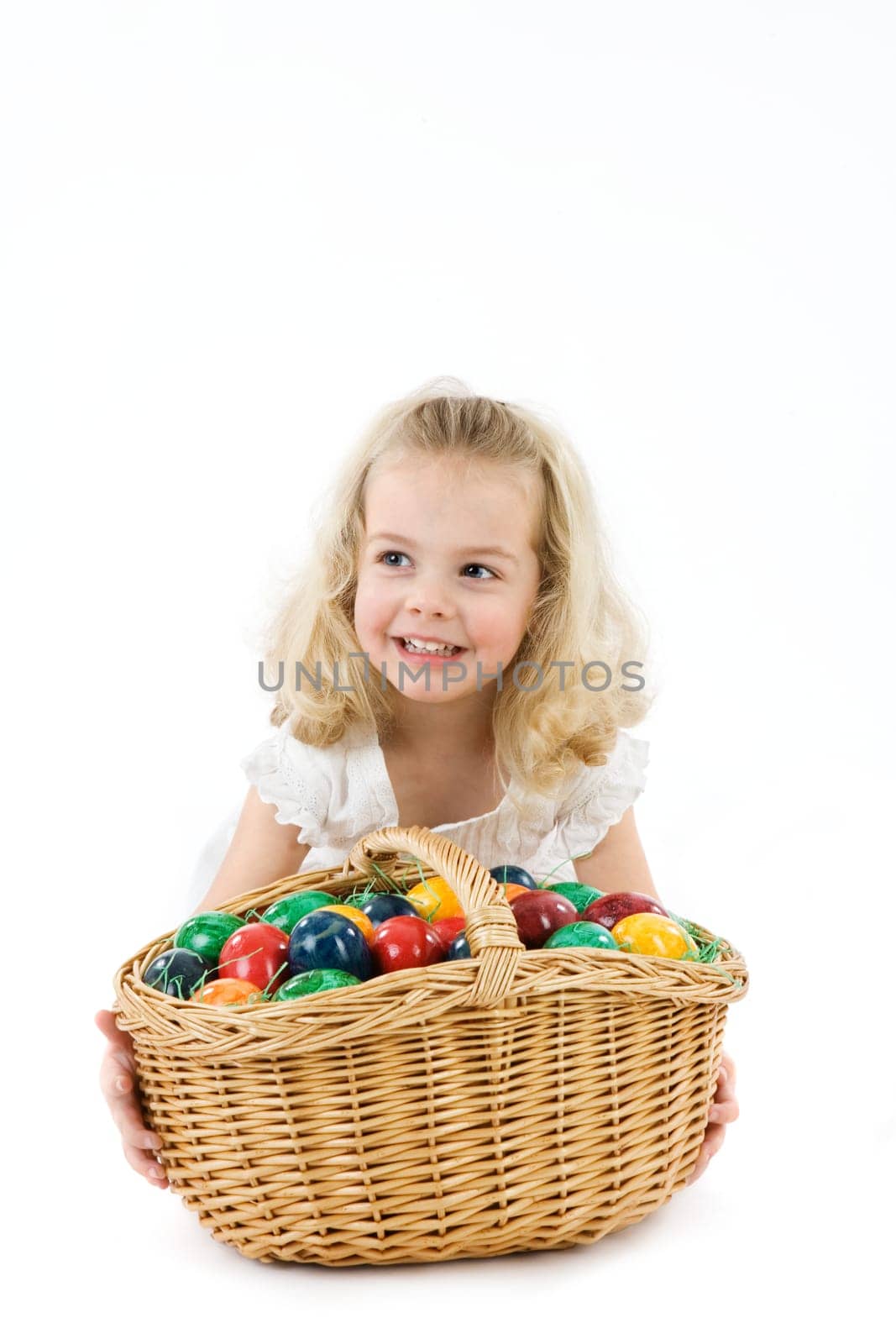 Girl with Easter eggs in basket